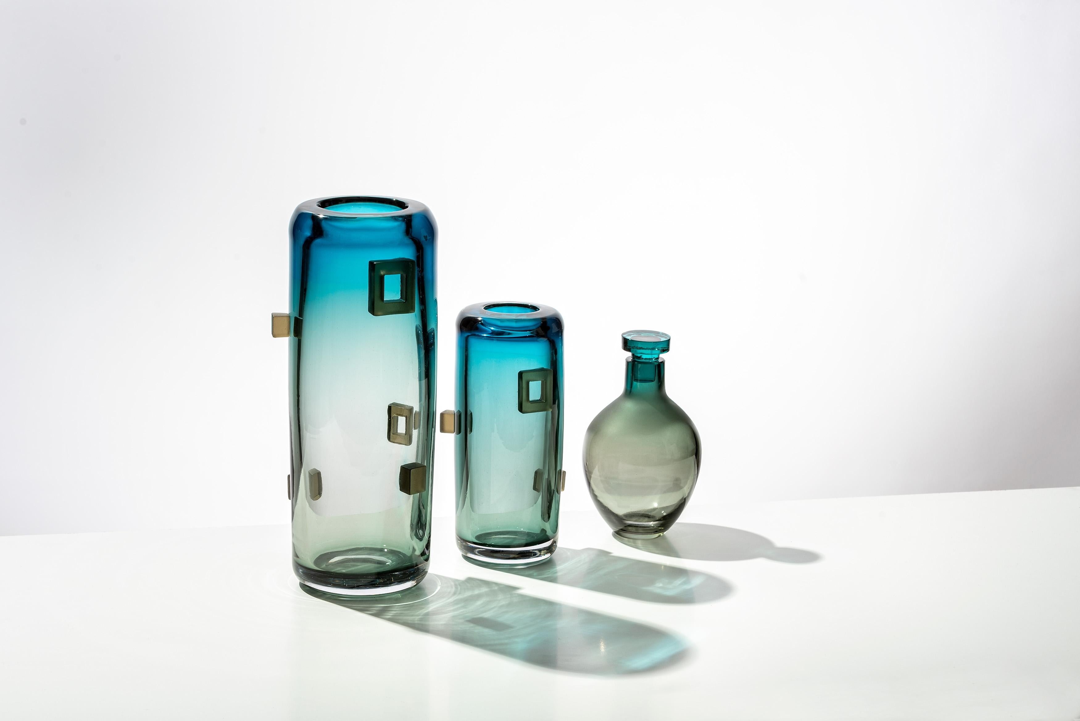 Truly unique glass liquor decanters that will style your bar like no other. Each piece of this glass barware is custom made, mouth blown using two attractive colors that blend into each other.
Handmade by Feleksan Onar, a prominent glass artist with