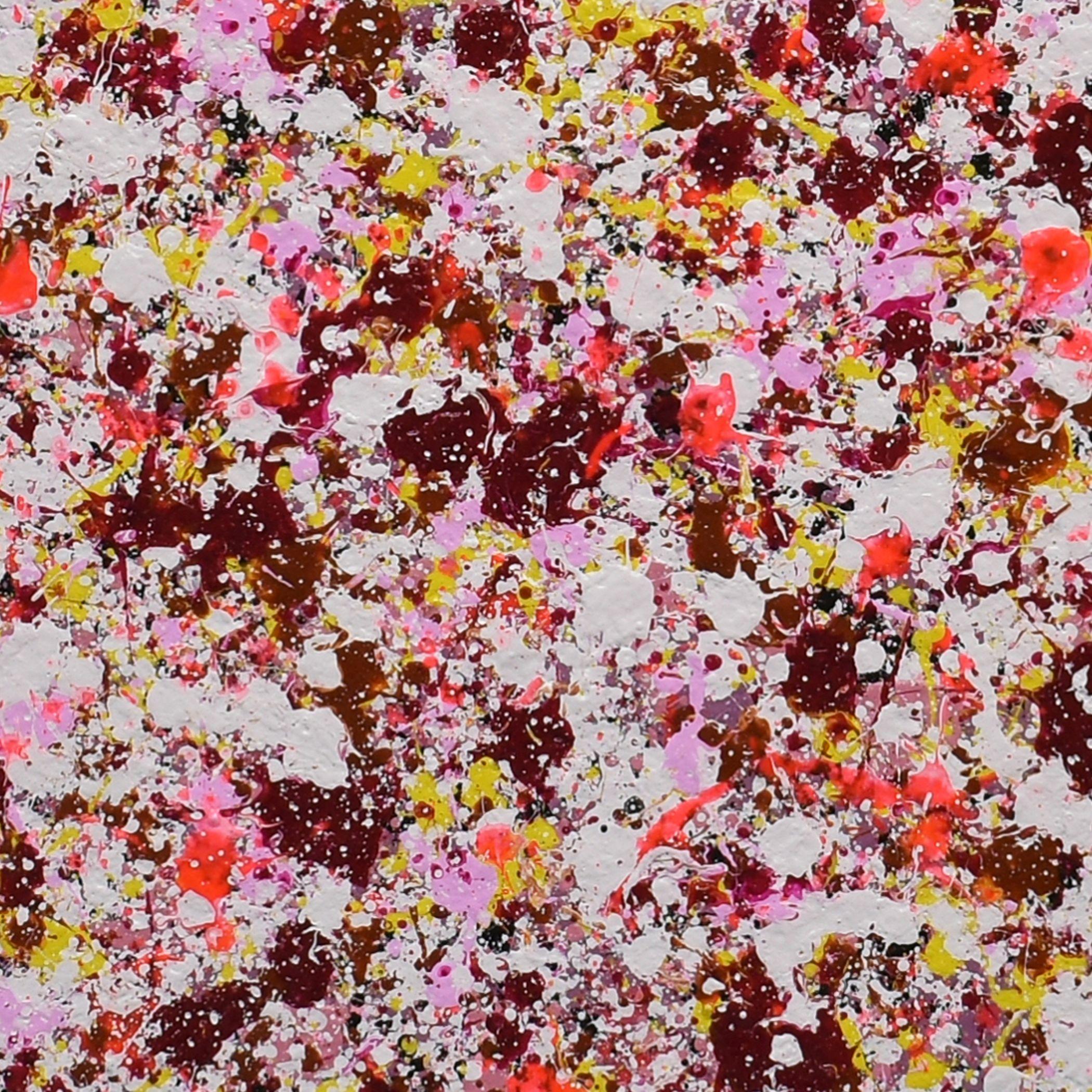 Petal Burst 39 is an abstract painting in acrylic on canvas. Pink, red, maroon and yellow explode onto a pale pink background. It is part of the Petal Burst series, a collection of floral abstract paintings where drip and spatter techniques are used