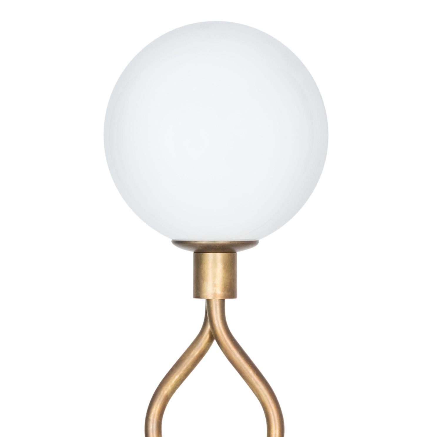 ELD
D. 160 mm
H. 500 mm
Max 10 W E14
1445-6 Raw brass/matte opal

The lamps are wiring with standard Europe wiring.

Fire Klot is a table lamp designed by Lisa Hilland. The elegant lamp is made of raw brass and has beautiful and decorative
