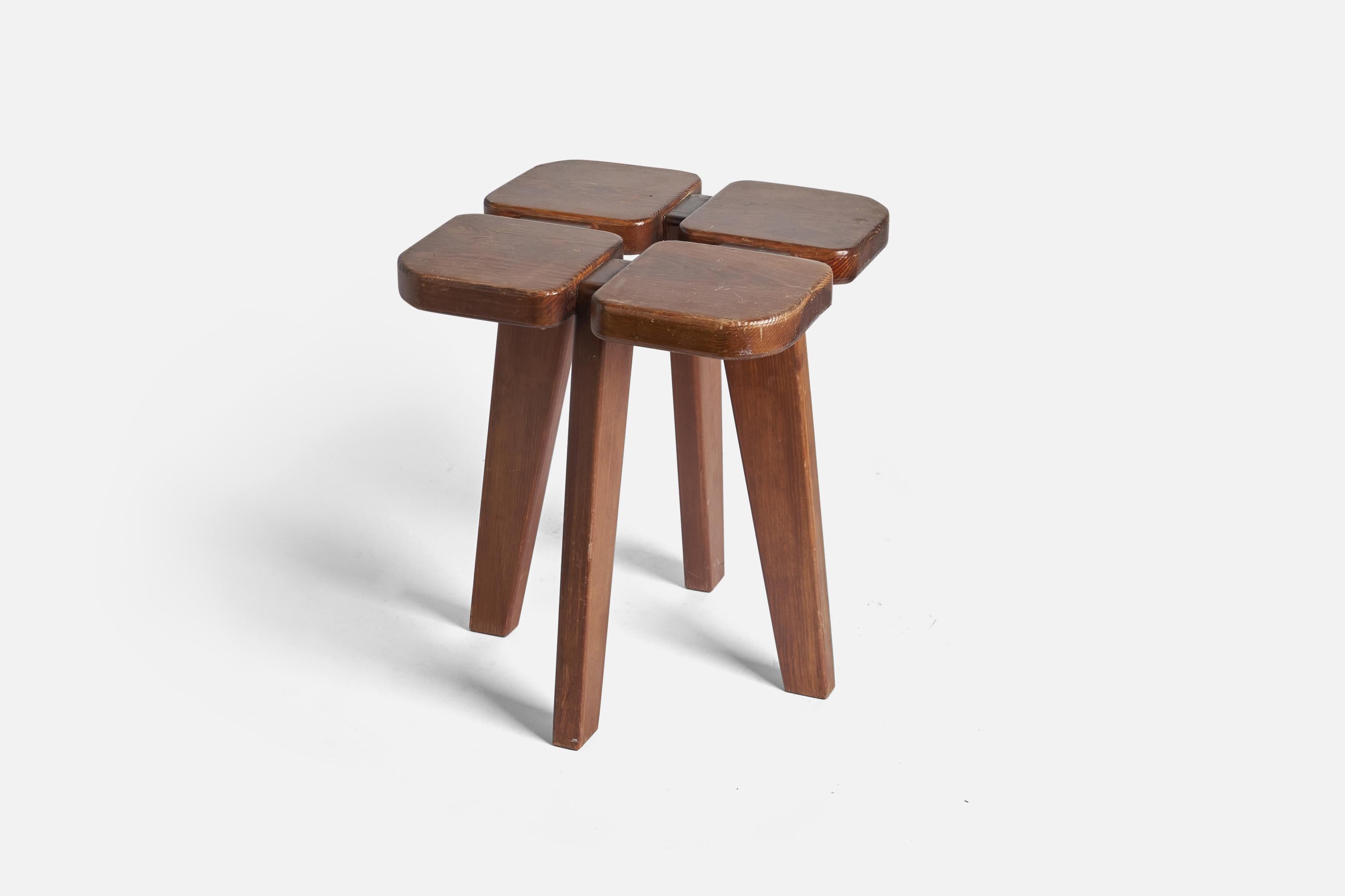 A stained pine stool, model 