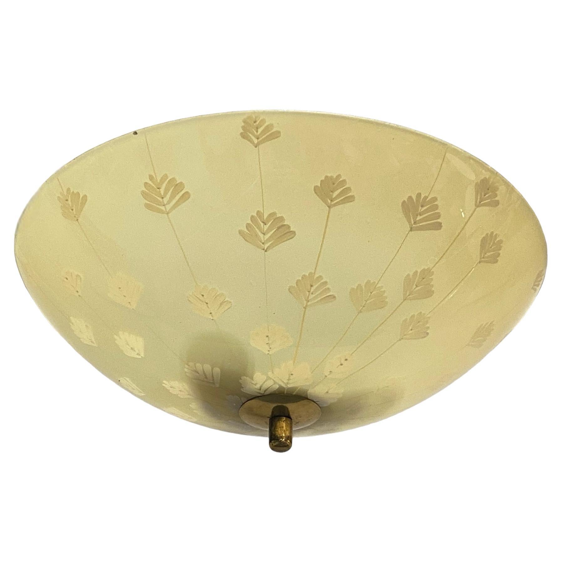 A beautiful ceiling pendant with hand painted on flower decorations, designed by Lisa Johansson-Pape and manufactured by Orno Oy in Finland in the 1950s. The lamp is in it's full original condition down to the wirings. The glass shade is also