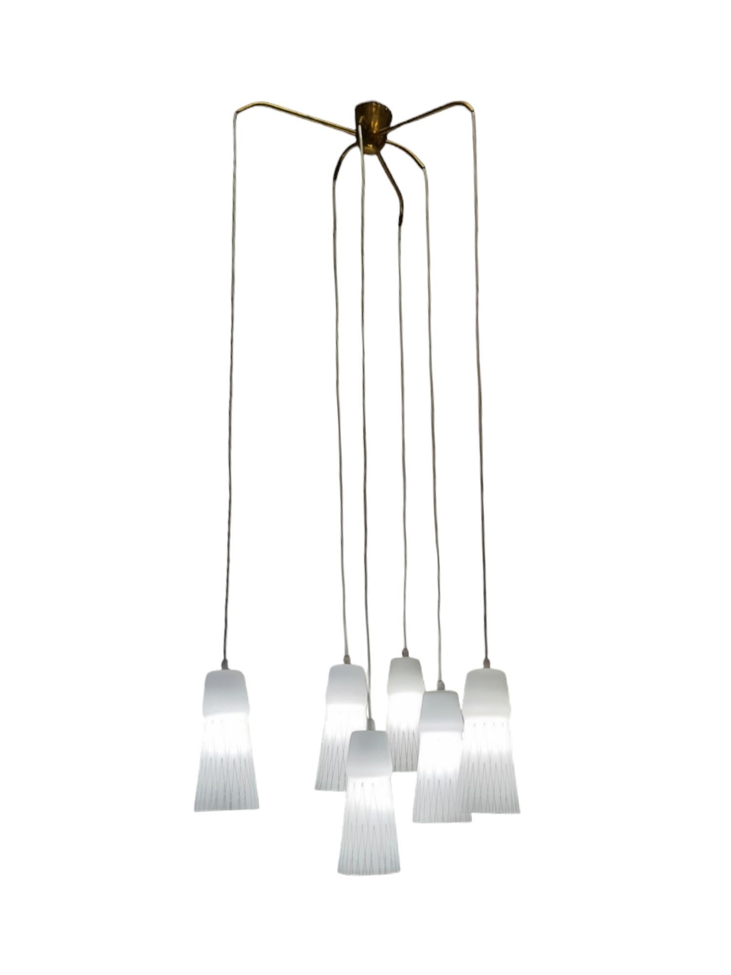 A beautiful pendant with six hand-painted and blown opaline glass shades model 66-017 by Lisa Johansson-Papé for Orno. The glass shades hang freely with the electric cords so they can be easily shortened or extended with new cords if needed. Also