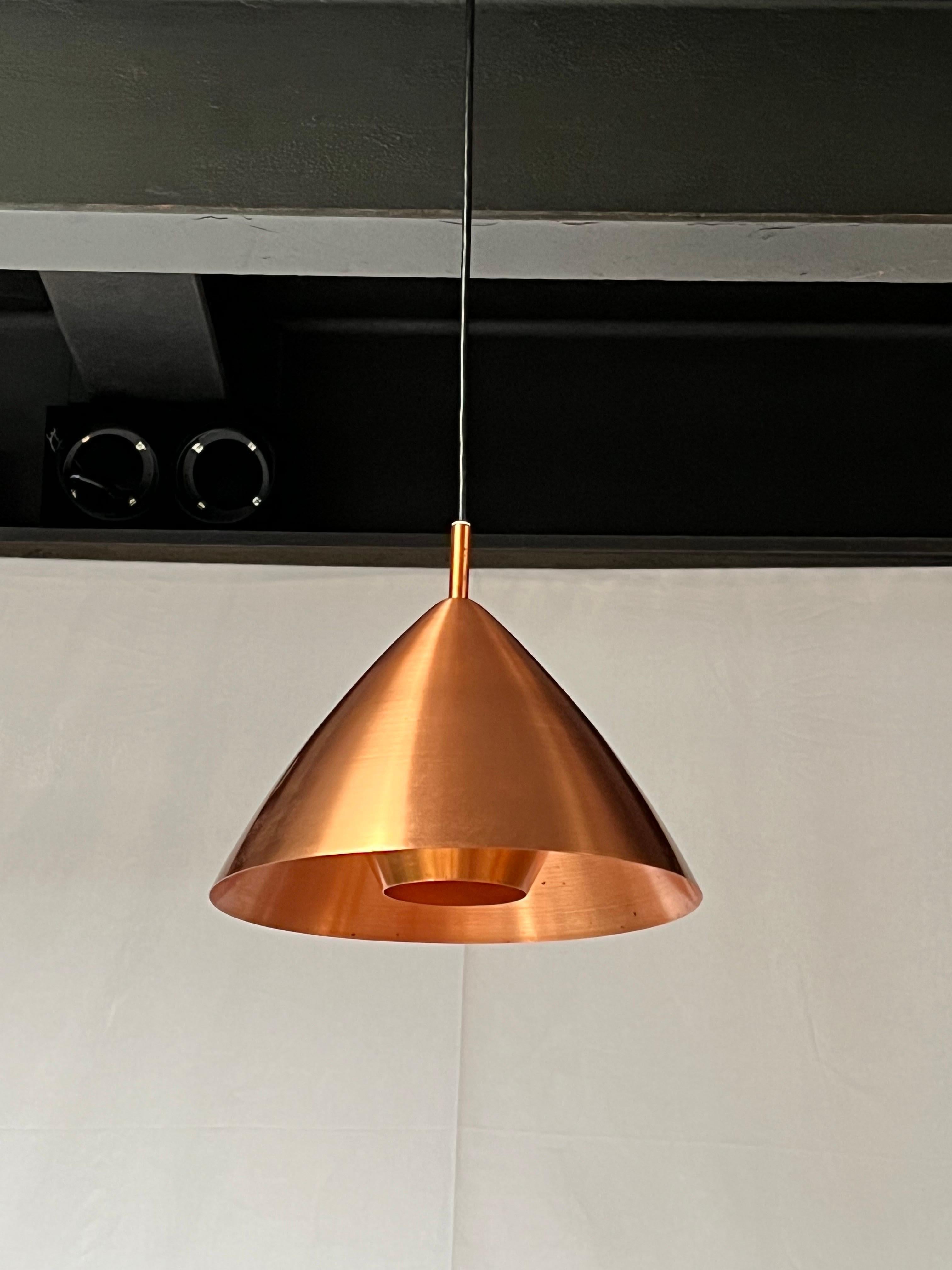 Delicate copper and suspension lamp made in the 1950s. Designed by the finish female designer Lisa Johansson-Pape.  The lamp come light copper patina. Easy to fix install. The lamp remain in excellent condition and is ready to be used.
