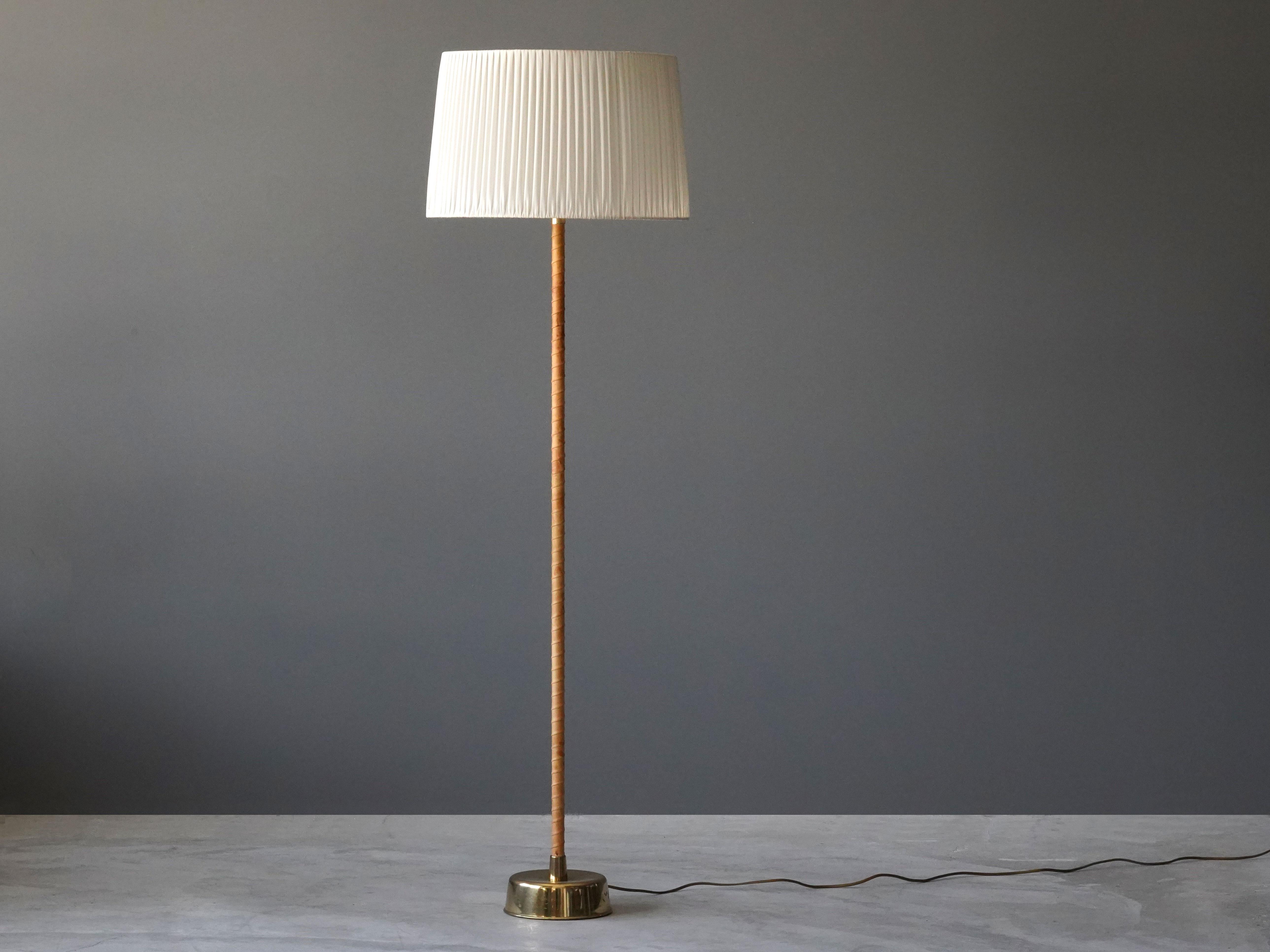 A floor lamp designed by Lisa Johansson-Pape in 1950. Variation on the 