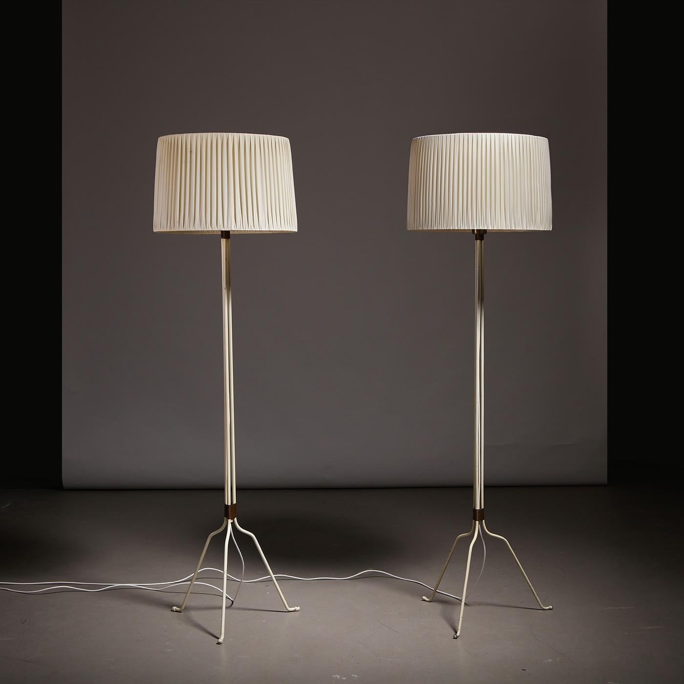 Lisa Johansson-Pape for Orno, pair of model ’30-058′ floor lamps, white-lacquered metal, brass, opal glass, white fabric shades, Finland, 1940s.

These floor lamps were designed by Lisa Johansson-Pape (1907-1989). Manufactured by Orno in the 1940s.