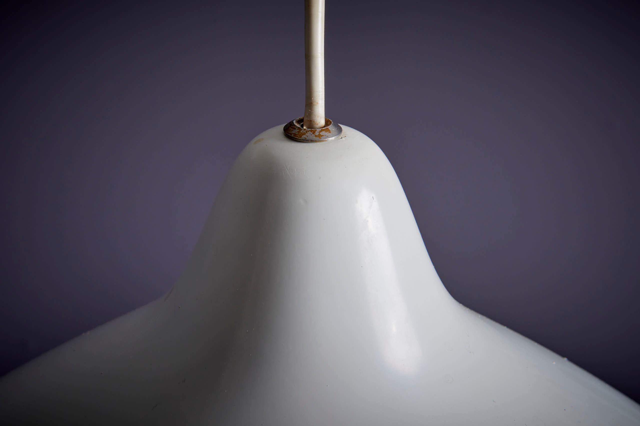 Lisa Johansson-Pape White Pendant Lamp in Aluminum, Finland 1960s. Lisa Johansson-Pape, a Finnish designer (1907-1989), is celebrated for her iconic Mid-20th-century lighting fixtures. Her designs, known for clean lines and timeless appeal, include