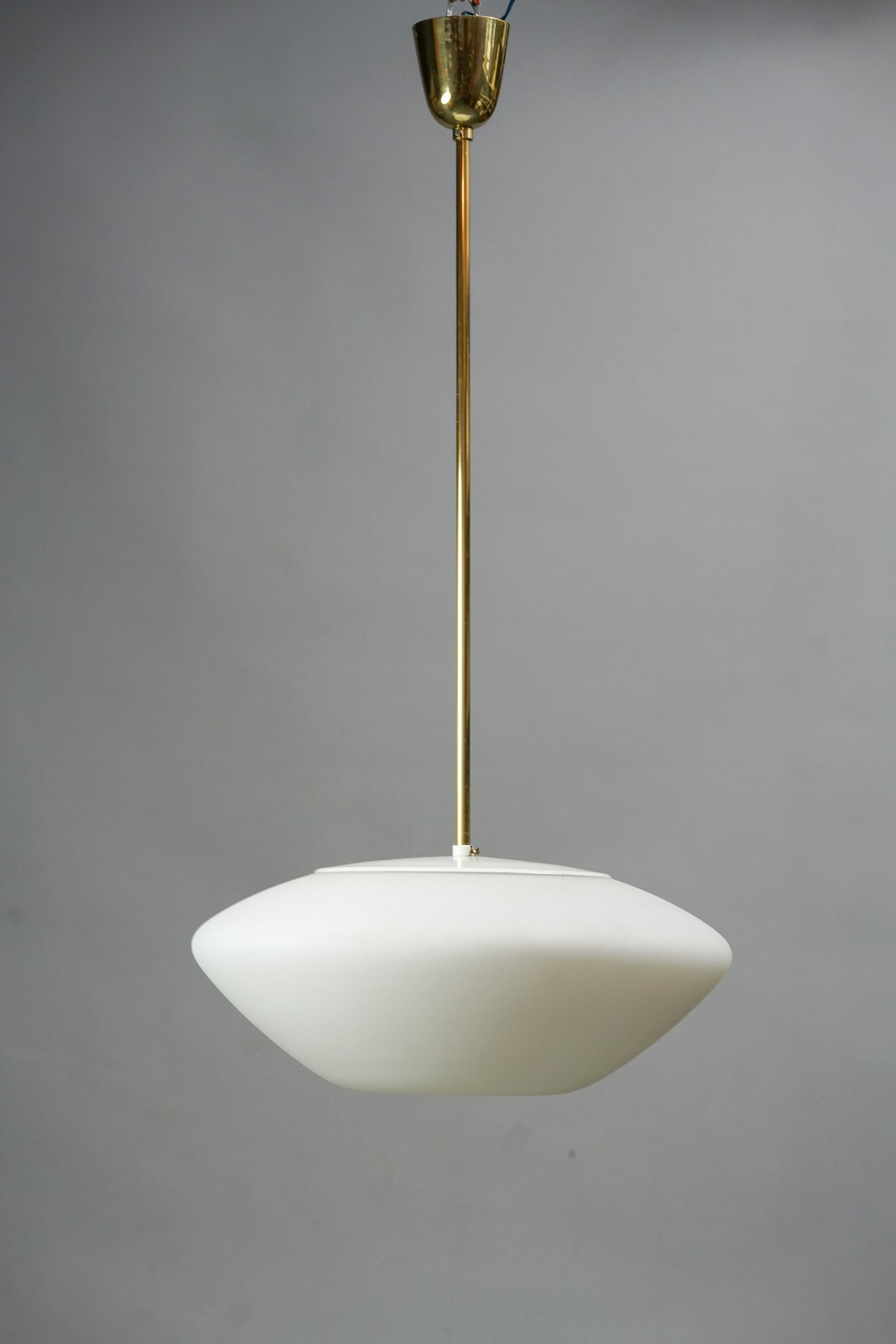 Lisa Johansson-Pape Model 61-339 pendant for Orno from the 1960s. Opaline glass shade with brass details. Good vintage condition, wear consistent with age and use. Iconic Lisa Johansson-Pape design.