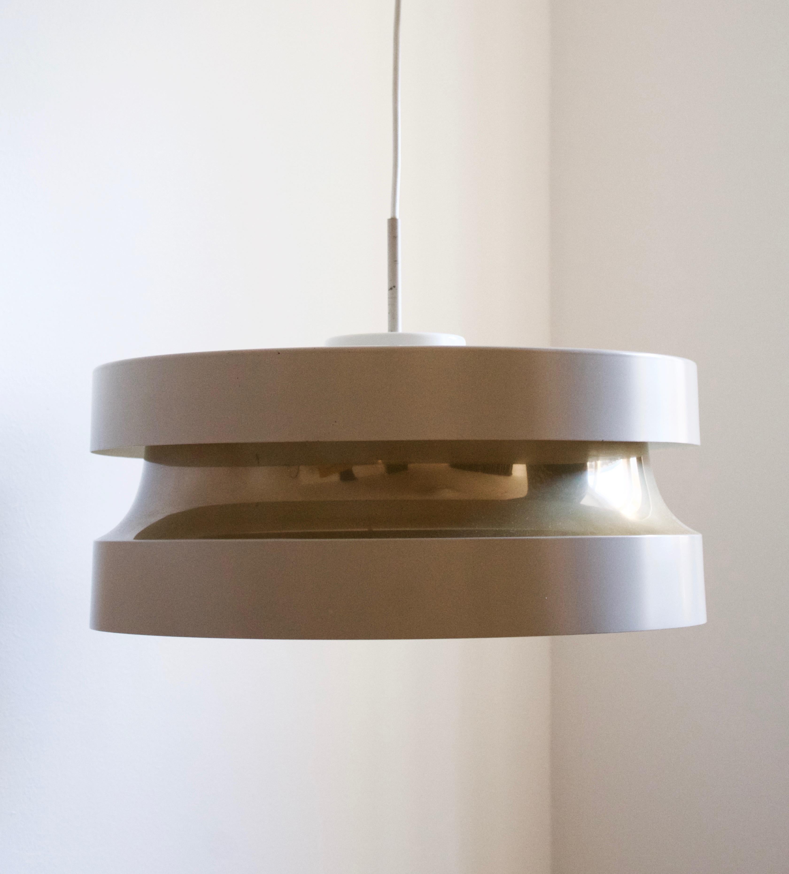 A pendant light. Designed by Lisa Johansson-pape for Stockmann Orno Oy. In lacquered metal and plastic. 

Stated height excludes electrical cord and cup. Drop is adjustable.