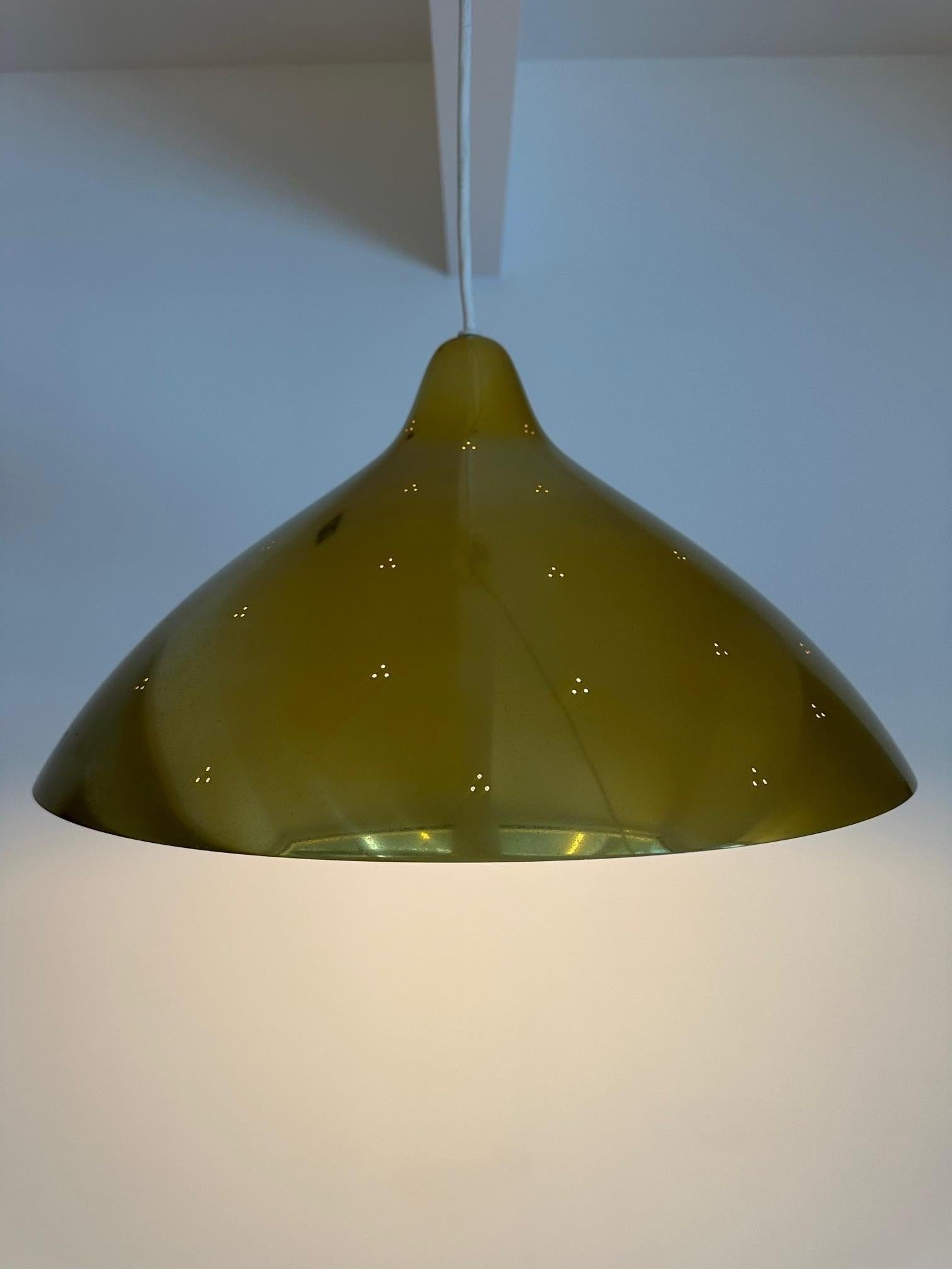 With a large scale of 44 cm in diameter, it will make a bold and striking statement in any room. This pendant is made for Thorn-Orno, a renowned Finnish lighting brand known for their high-quality and innovative designs. The brass finish adds a