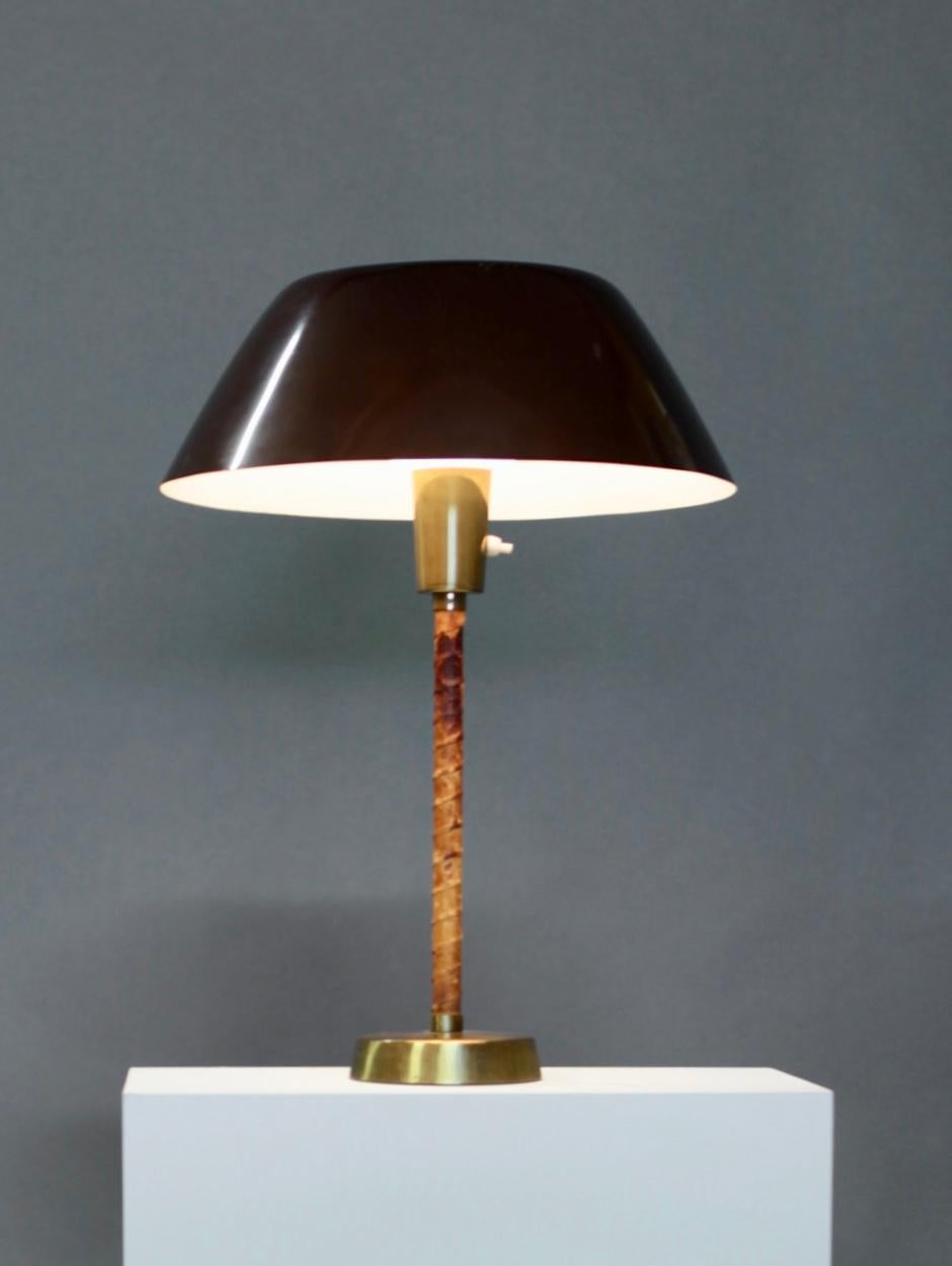 Lisa Johansson-Pape,
Senator table lamp, designed 1947, by Orno in Finland.
Leather, brass and brown painted metal shade,
Manufacture mark.