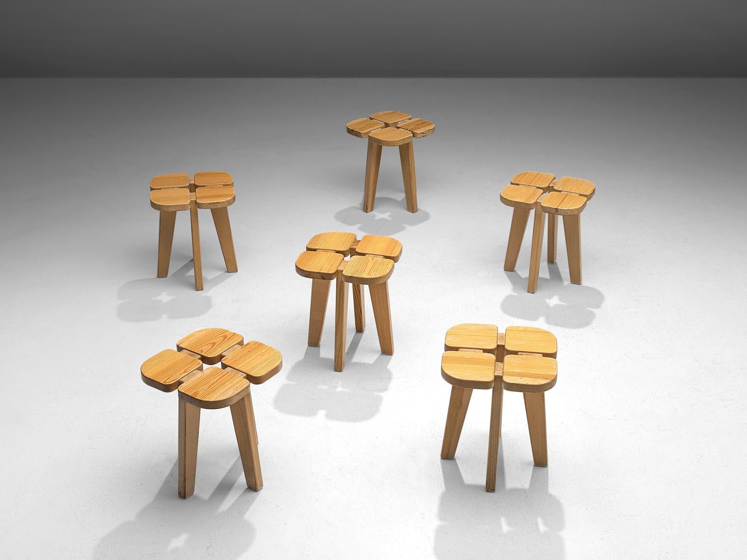 Lisa Johansson-Pape for Stockman Orno, set of 6 'Apila' stools, pine, Finland, 1960s. 

Set of 6 stools in solid pine. The design is simplistic: A clover top with four sloping legs. The construction of the stools is nicely visible on the top. Very
