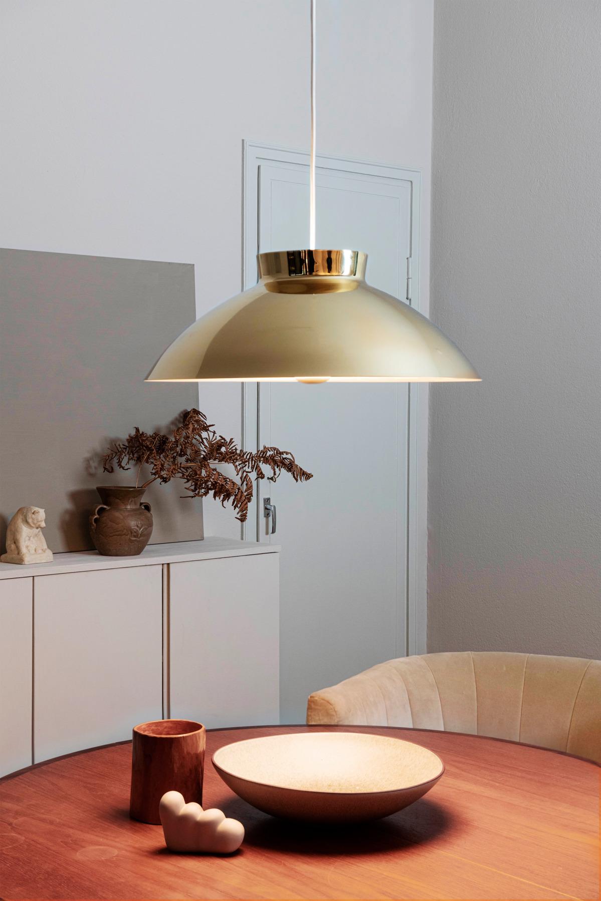 Lisa Johansson-Pape 'Sirri' pendant in brass for Innolux. Originally designed in the 1960s, these authorized re-editions by Innolux Oy of Finland are true to the original charming simplicity of Pape's iconic vision. The high-quality luminaire is