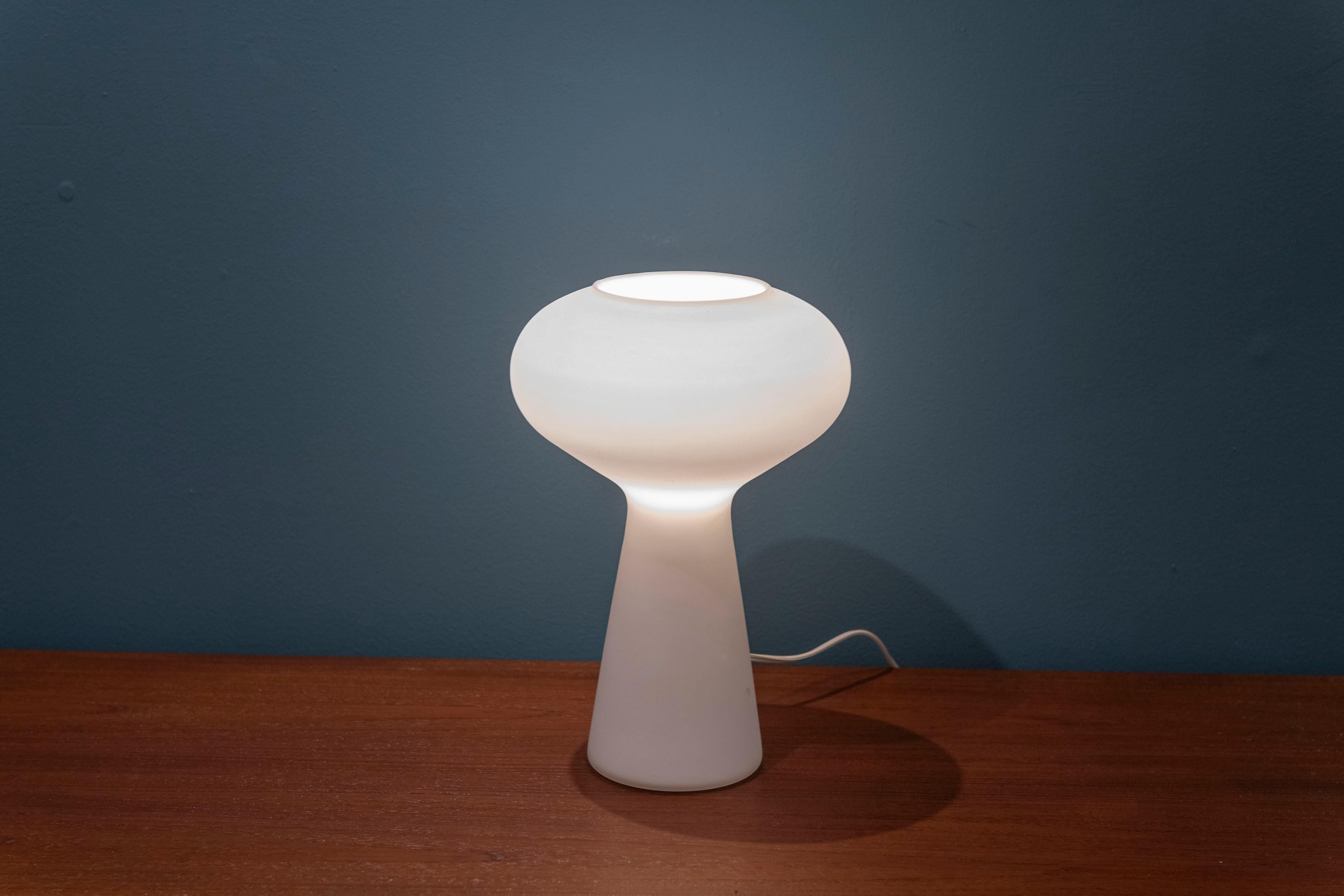 Lisa Johansson-Papa design table lamp, Sweden. Organic shaped body in opaque glass that emits a soft filtered light perfect for a console table credenza night light. Ready to install and enjoy.