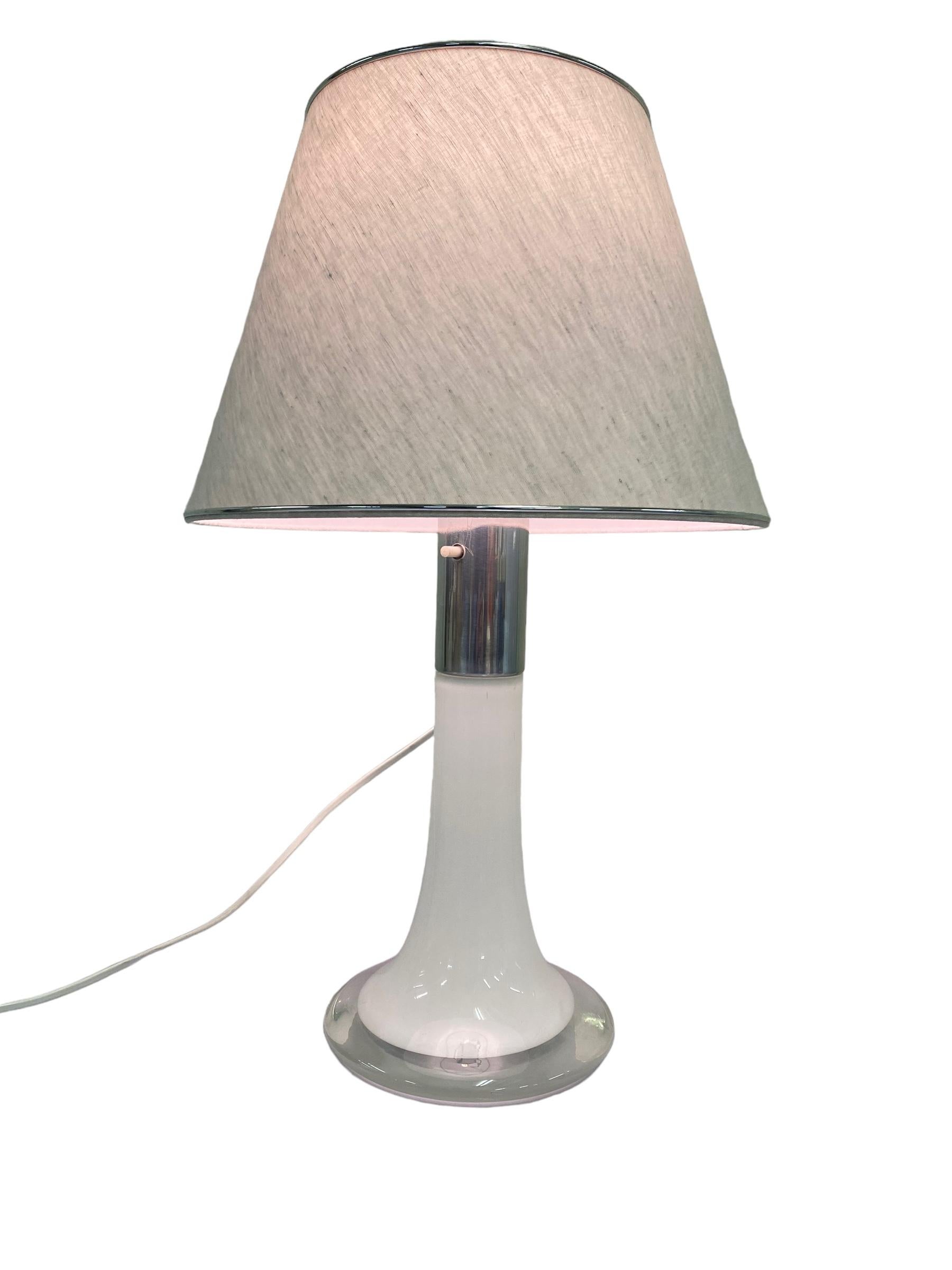 Table lamp model 46-017 in chrome and opaline glass designed by Lisa Johansson-Pape and manufactured by Orno Oy In Finland in the 1960s. This simple yet elegant design is one of the most well known designs from the renowned Lisa Johansson-Pape. A