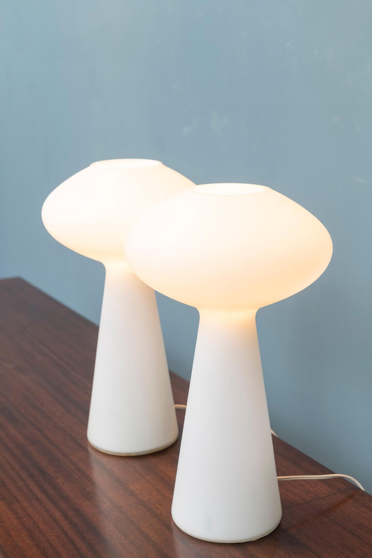 Pair of Lisa Johansson-Papa design opaque glass table lamps, nice organic contemporary design. These are the rarer larger size lamps and ready to install and enjoy.