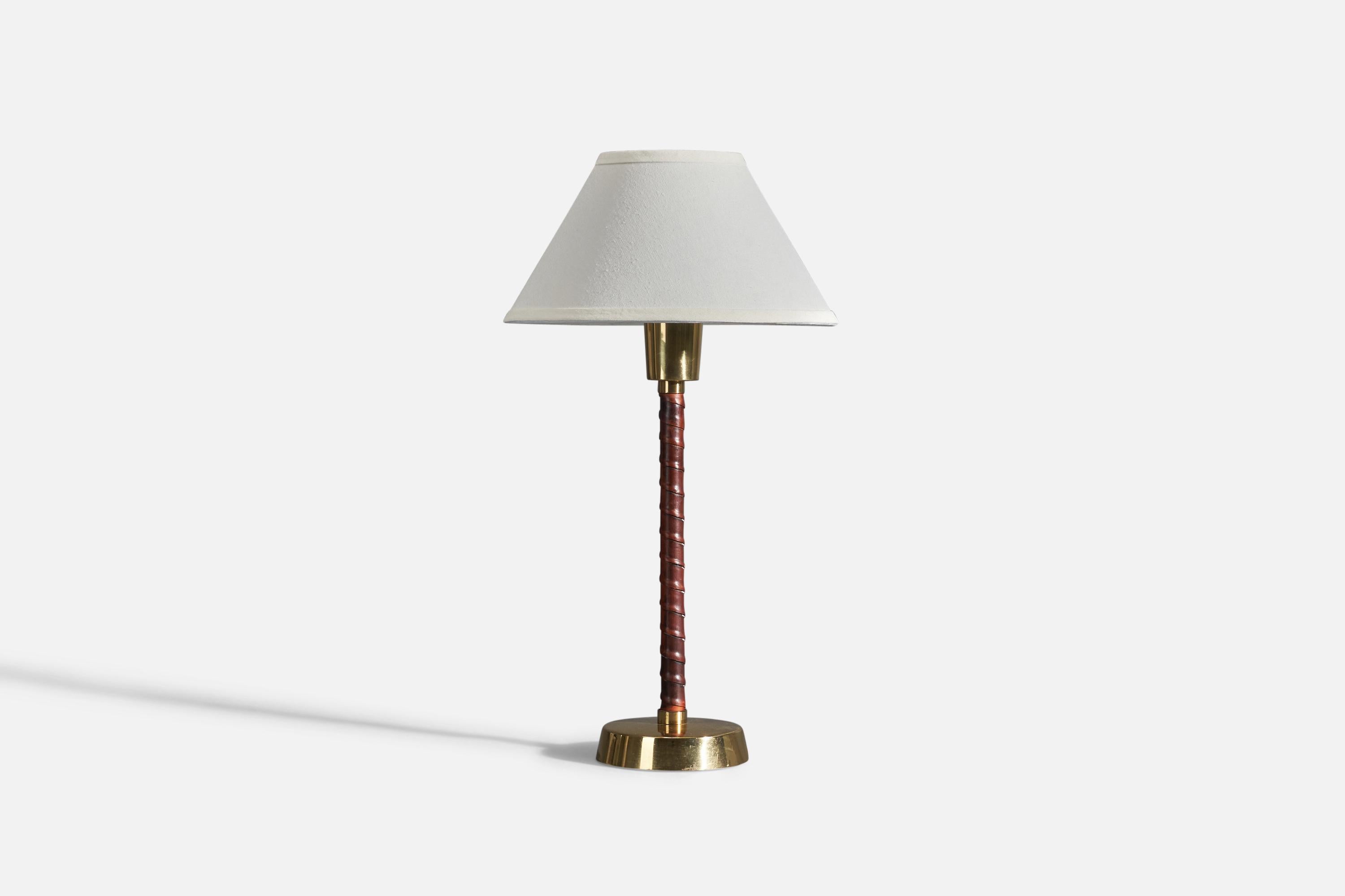 A pair of table lamps designed by Lisa Johansson-Pape and produced by Oy Stockmann-Ornö AB, Kerava, Finland,  1950.

Sockets take standard E-26 medium base bulbs.

There is no maximum wattage stated on the fixtures.