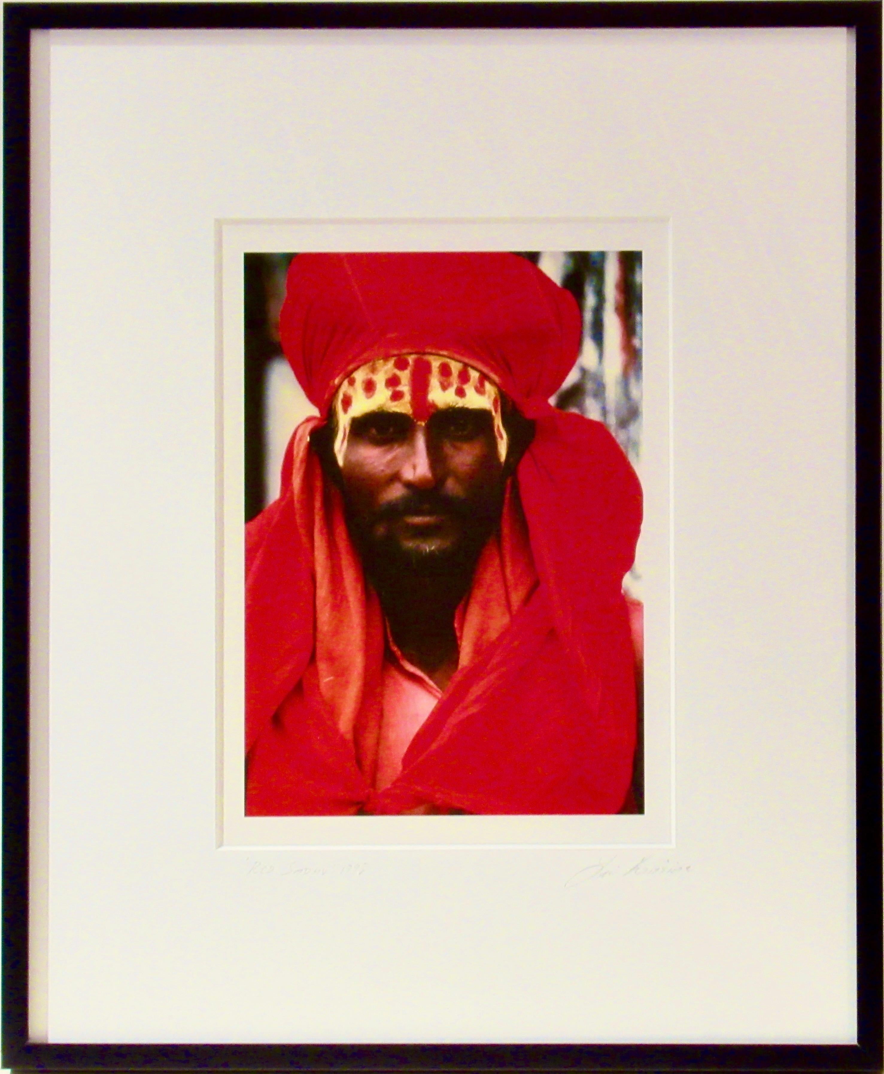 Color Photograph di Lisa Kristine - Red Sadhu, Rajasthan, India