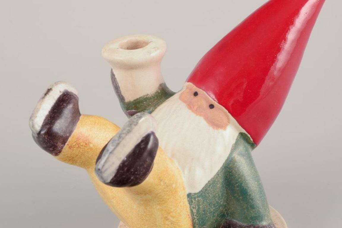 Swedish Lisa Larson for Gustavsberg. Ceramic candlestick. Elf on skates. Late 20th C. For Sale