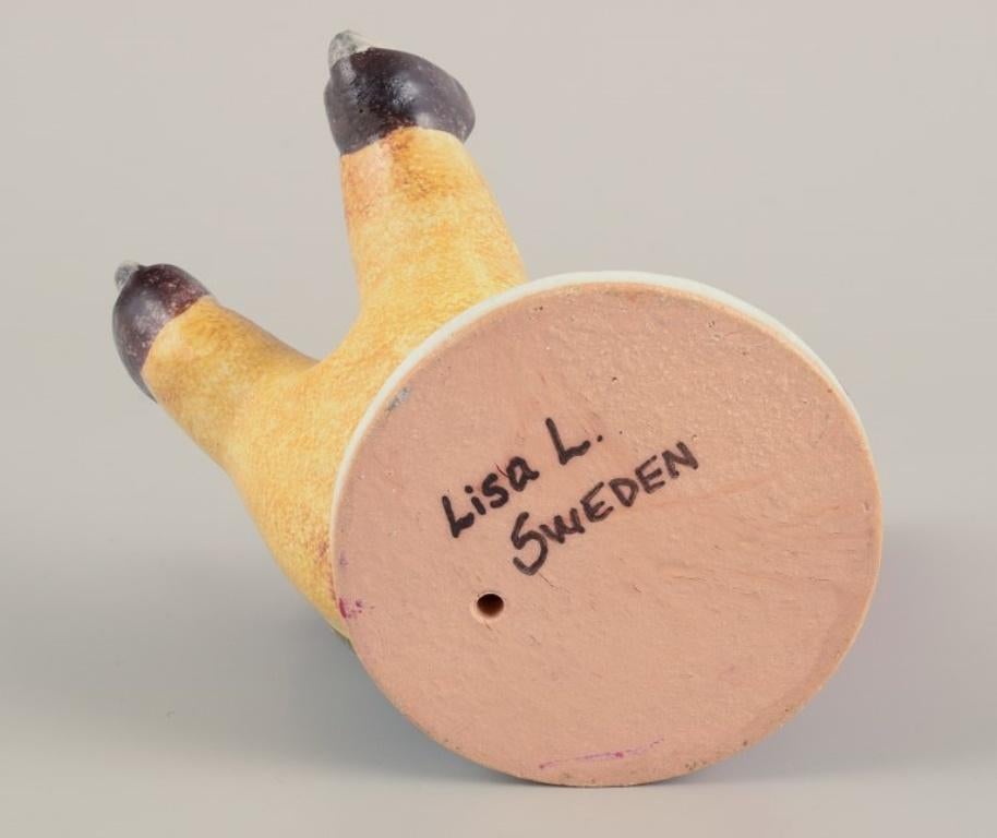Glazed Lisa Larson for Gustavsberg. Ceramic candlestick. Elf on skates. Late 20th C. For Sale