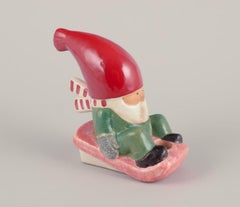 Lisa Larson for Gustavsberg. Ceramic candlestick. Elf on sledge. Late 20th C.