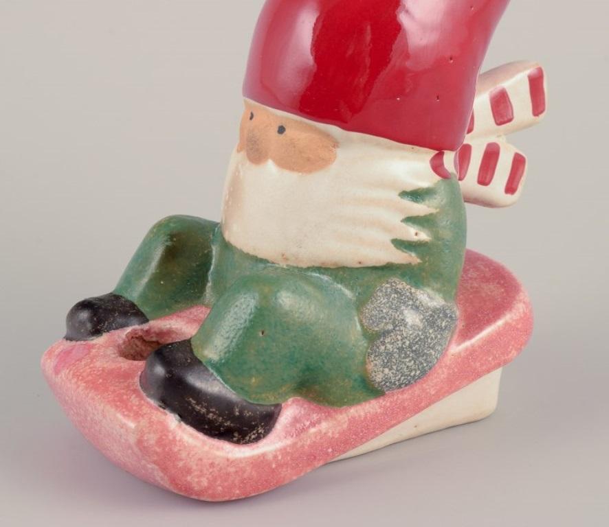 Swedish Lisa Larson for Gustavsberg. Ceramic candlestick. Elf on sledge. Late 20th C. For Sale