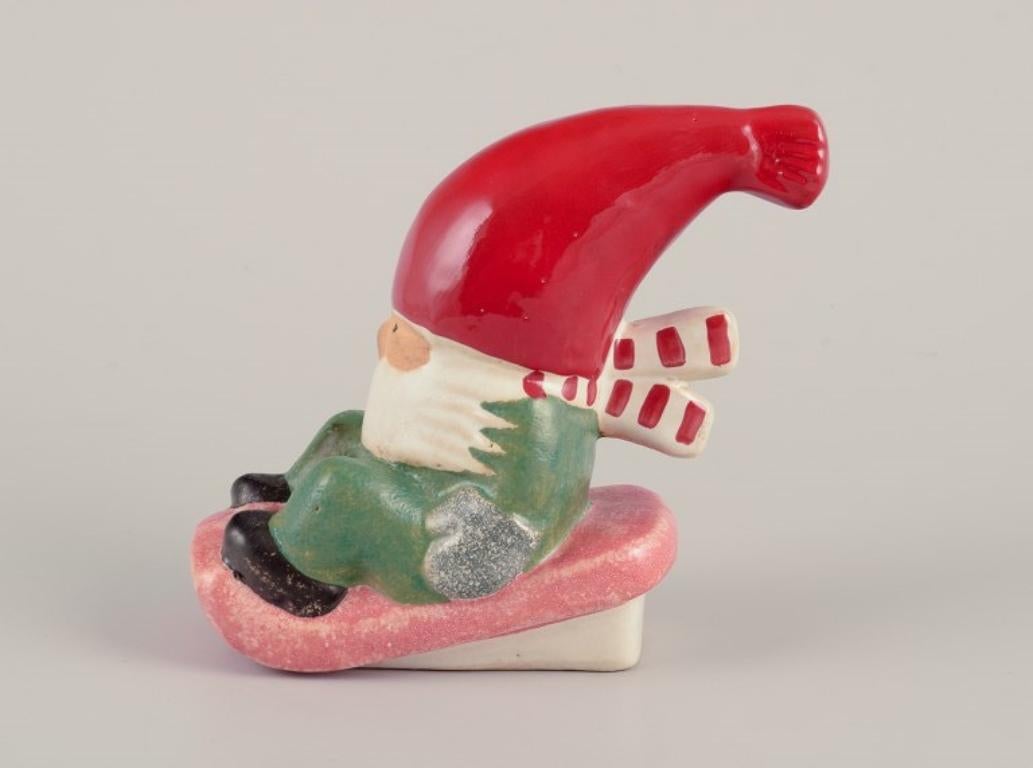Glazed Lisa Larson for Gustavsberg. Ceramic candlestick. Elf on sledge. Late 20th C. For Sale