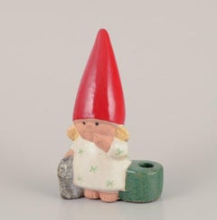 Lisa Larson for Gustavsberg. Ceramic candlestick. Girl elf and cat. Late 20th C.