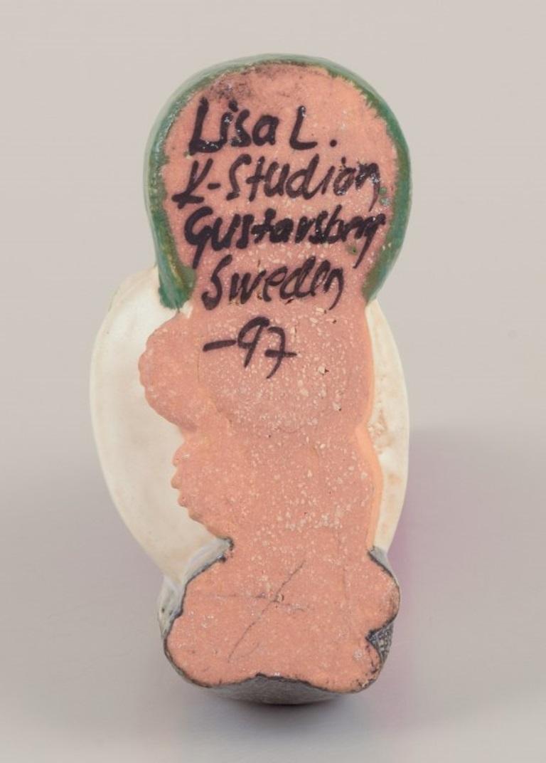 Glazed Lisa Larson for Gustavsberg. Ceramic candlestick. Girl elf and cat. Late 20th C. For Sale
