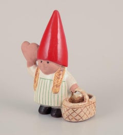 Lisa Larson for Gustavsberg. Elf girl with braided basket and honey heart.