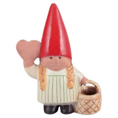 Lisa Larson for Gustavsberg. Elf girl with braided basket and honey heart.