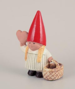 Lisa Larson, Gustavsberg, Sweden. Elf girl with braided basket and honey heart.