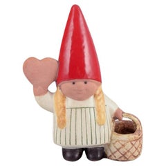Lisa Larson, Gustavsberg, Sweden. Elf girl with braided basket and honey heart.