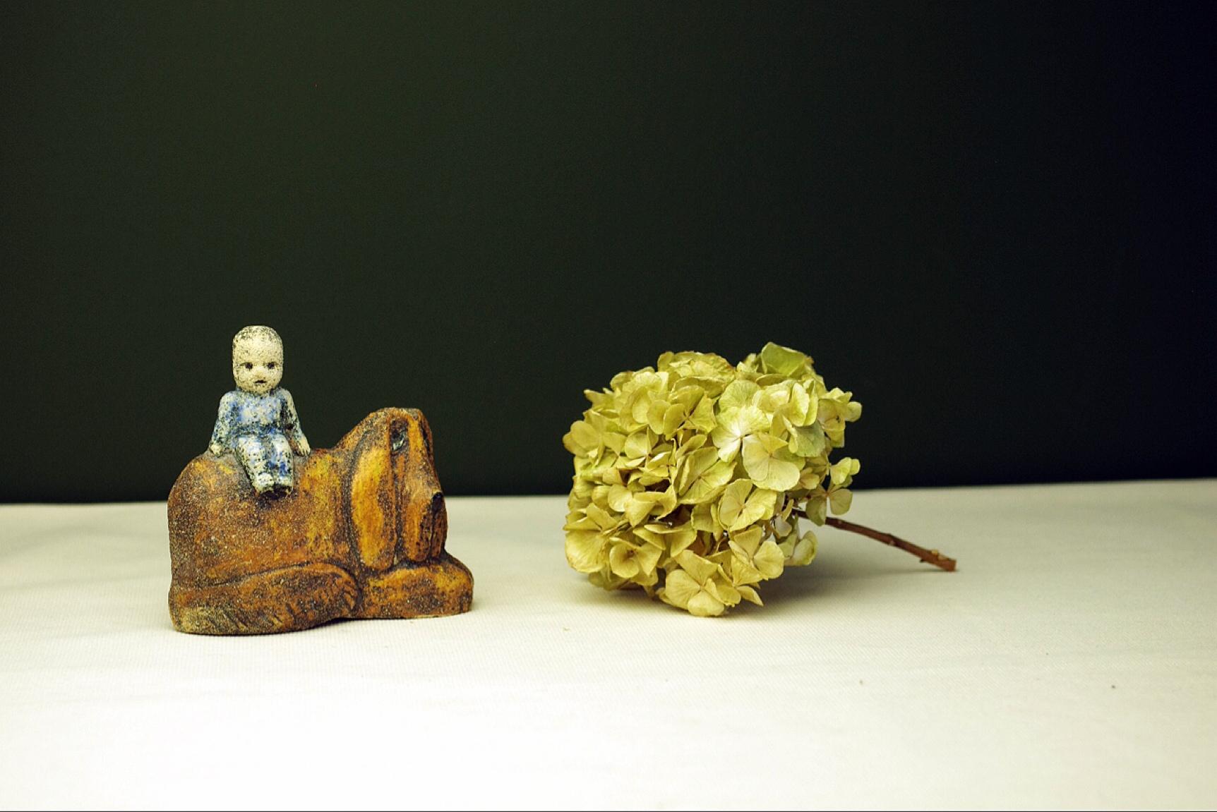 Product Description: 
On offer is a unique piece by Lisa Larson showing a small child sitting on a dog. Although the piece is made years after Lisa's most well-known works for Gustavsberg the work still breathes the same 'softness', the comforting