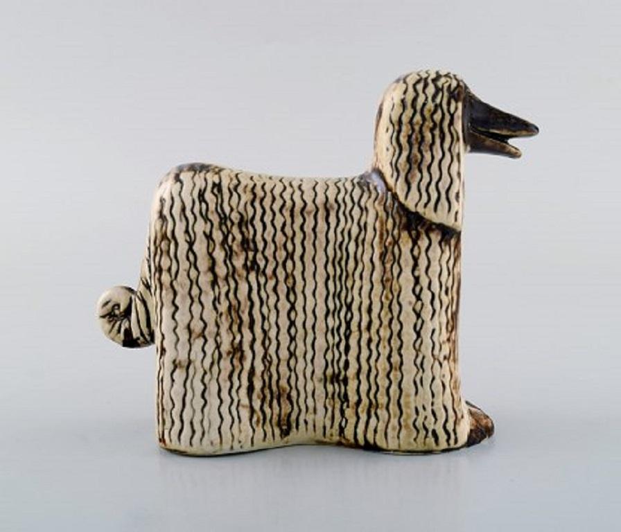 Lisa Larsson ceramics, 2 Afghan dogs, Afghan hound.
Lisa Larson is a Swedish ceramic designer who started in Gustavsberg Porcelain factory in 1953. Lisa Larson is best known for her humorous and friendly characters.
Measures: 12 x 11.5 cm.
In
