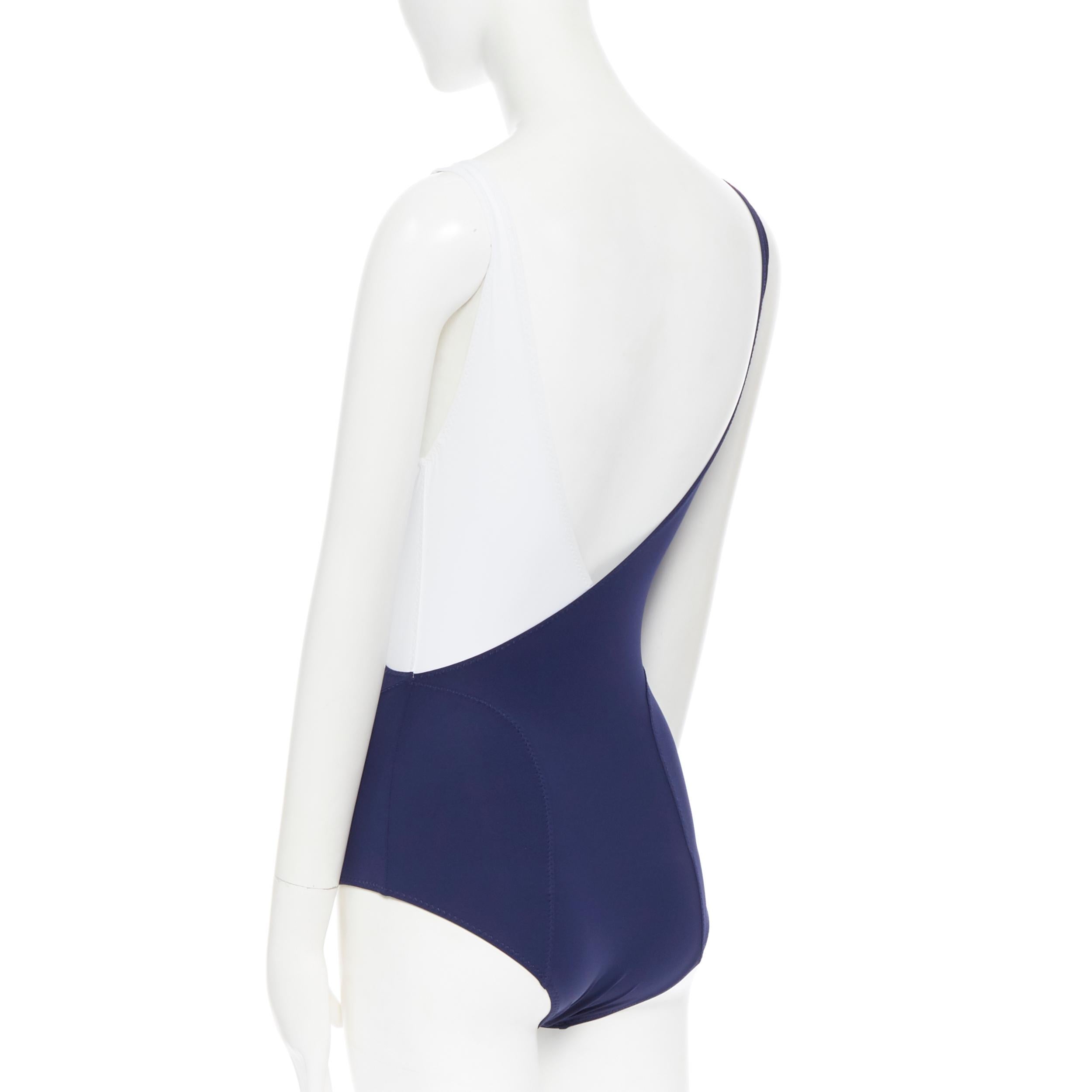 LISA MARIE FERNANDEZ navy blue white crossover plunge neck one piece swimsuit XS 
Reference: LNKO/A01316 
Brand: Lisa Marie Fernandez 
Material: Other 
Color: Navy 
Pattern: Solid 
Closure: Pull on 
Made in: United States 

CONDITION: 
Condition: