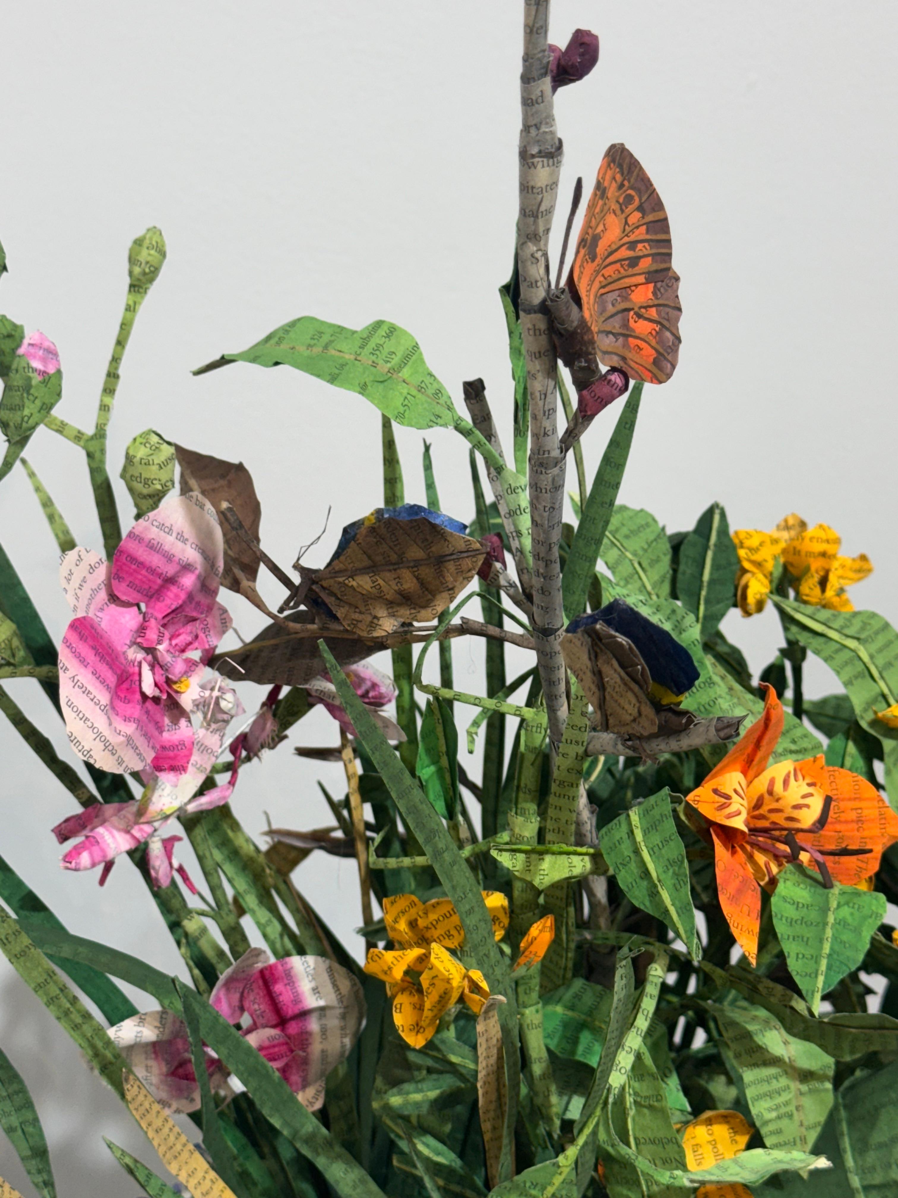 Lisa Meek transforms books by cutting their bindings, painting the pages and folding them to create floral blossoms rooted in the words of the authors. Each page has been lightly tinted adding a dimension of color to the work without obscuring the