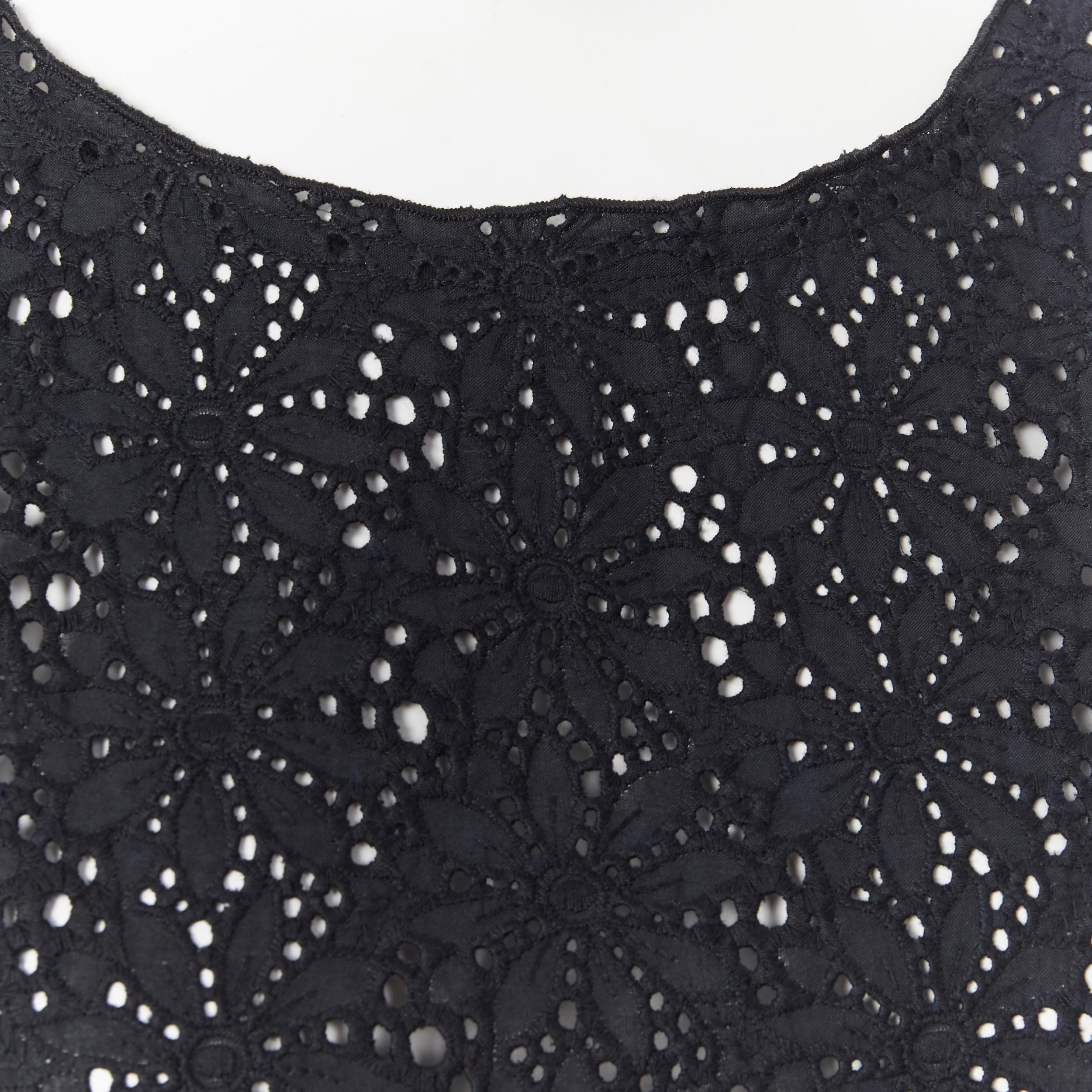 LISA PERRY 100% cotton black floral embroidery anglaise sleeveless top US2 
Reference: LNKO/A01253 
Brand: Lisa Perry 
Material: Cotton 
Color: Black 
Pattern: Floral 
Extra Detail: Floral embroidery anglaise. A-line cut. 
Made in: United States