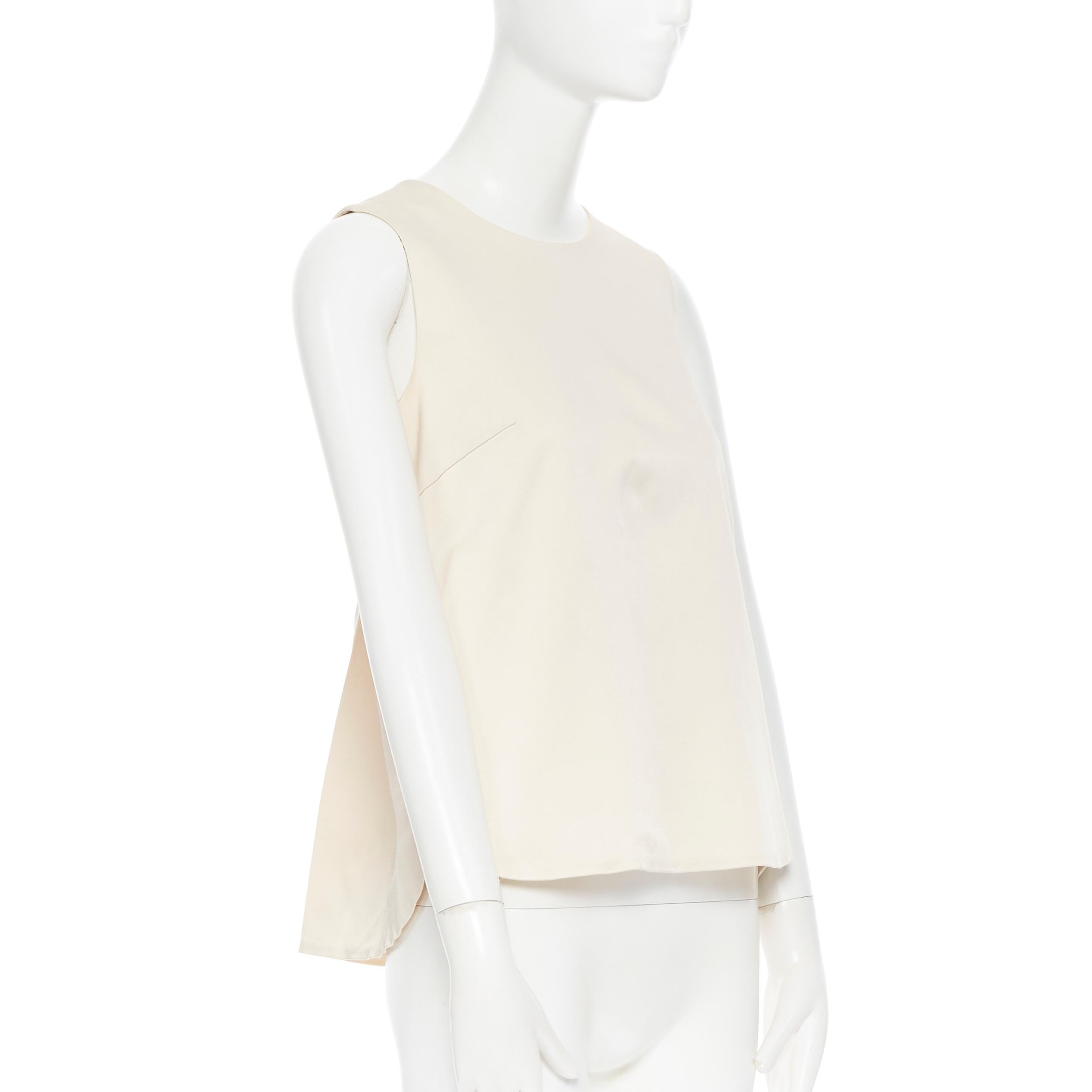 LISA PERRY beige stiff viscose curved hem dual slit pocket sleeveless top US0
Brand: Lisa Perry
Designer: Lisa Perry
Model Name / Style: Boxy top
Material: Viscose, wool, elastane
Color: Beige
Pattern: Solid
Closure: Zip
Lining material: Silk
Extra