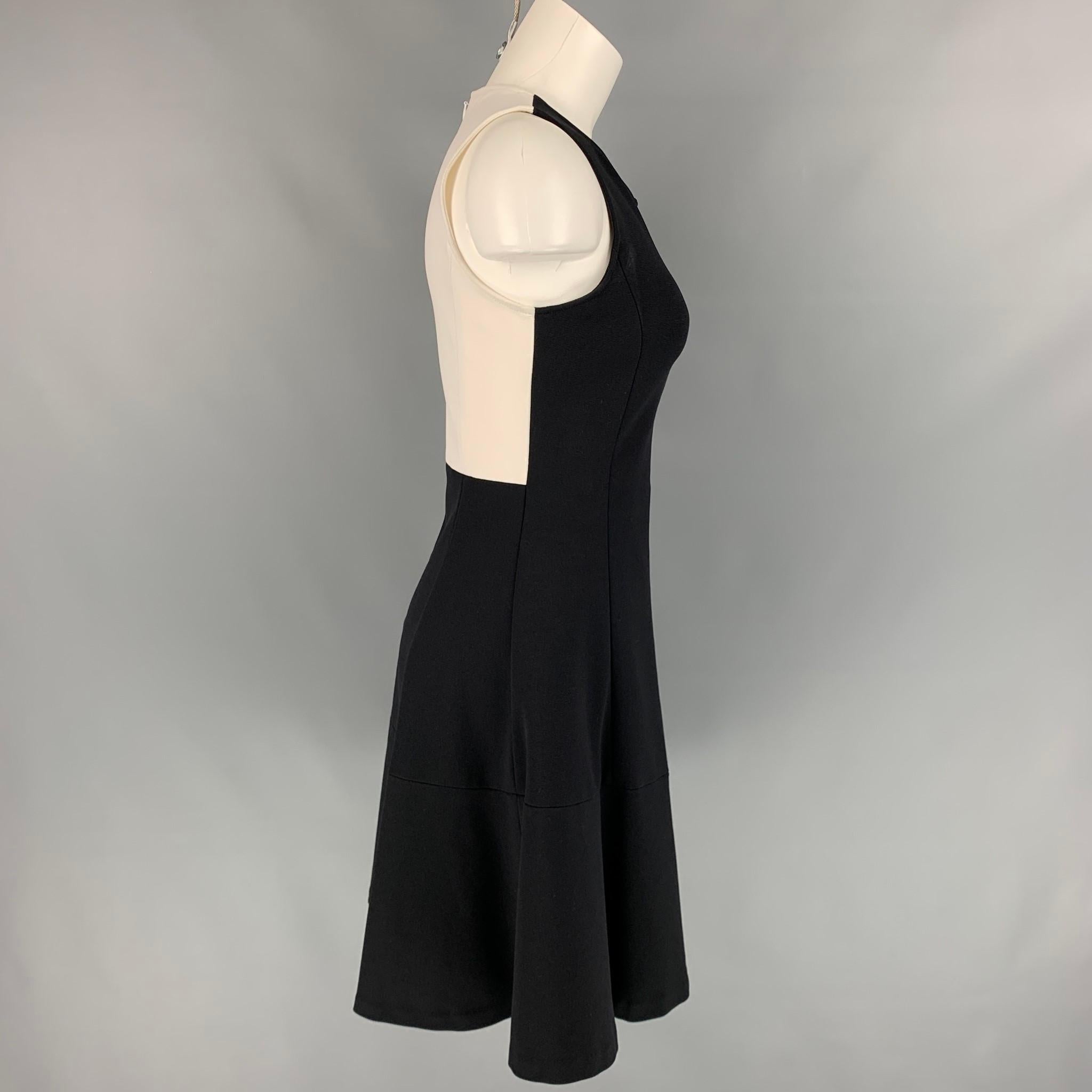 LISA PERRY x BARNEY'S NEW YORK dress comes in a black & white color block polyamide featuring a sleeveless style, a-line, and a back zipper closure. 

Very Good Pre-Owned Condition.
Marked: 2

Measurements:

Shoulder: 12 in.
Bust: 30 in.
Waist: 26