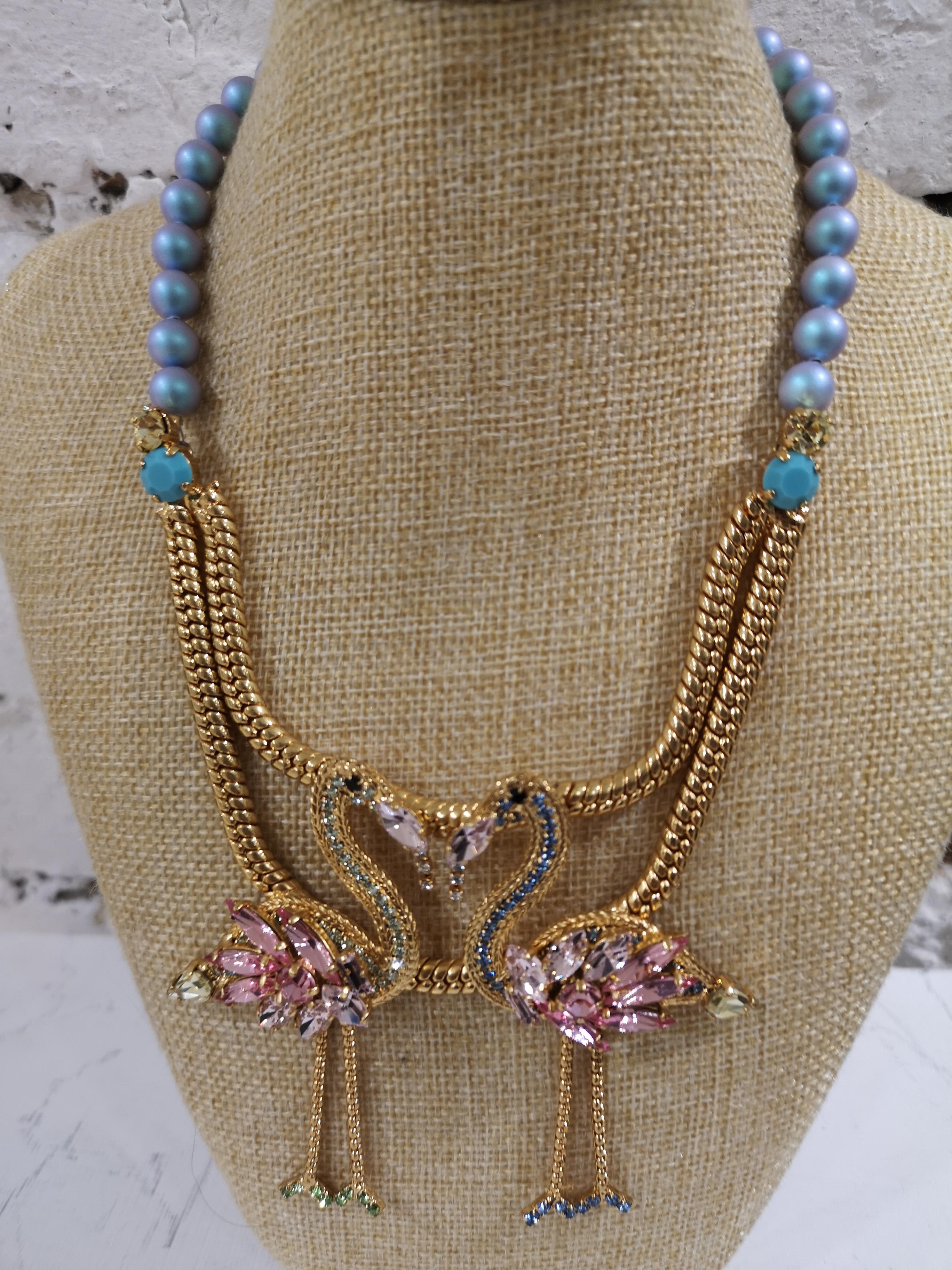LisaC Flamingos light blue pearls neacklace
LisaC totally made in italy necklace embellished with two flamingos with light pink swarovski and surrounded by light blue faux pearls necklace on a rose gold tone brass necklace
total lenght from 37 cm up
