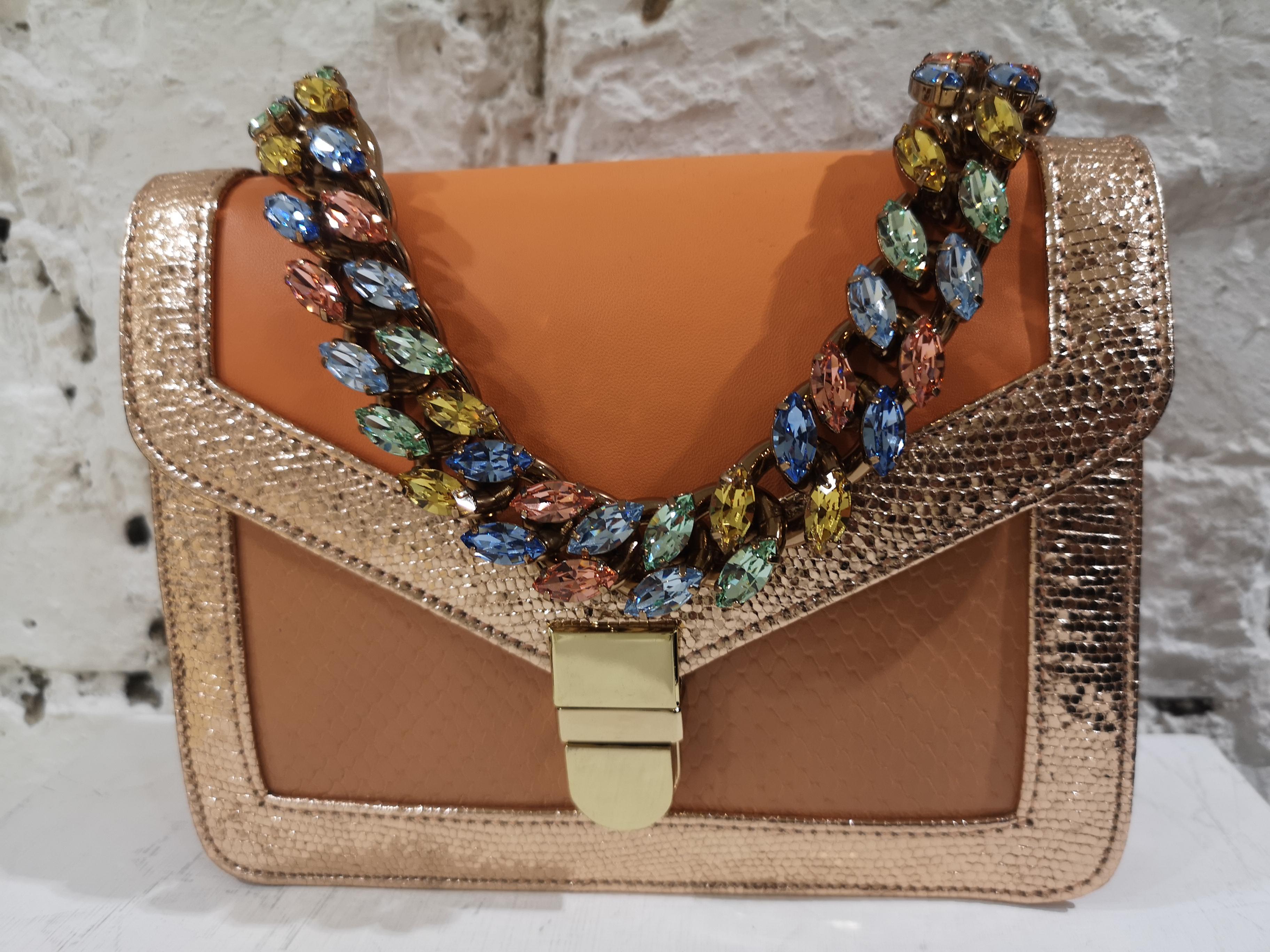LisaC orange textile and leather shoulder handbag
embellished with swarovsky handle