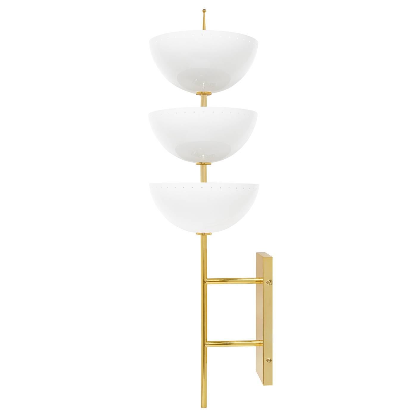 Magic mood. Large and in charge, our Lisbon sconce is a glamorous gesture that's just as elegant in a studio apartment as it is in an Italian palazzo. A polished brass stem supports three half spheres of ivory enameled metal with subtle round