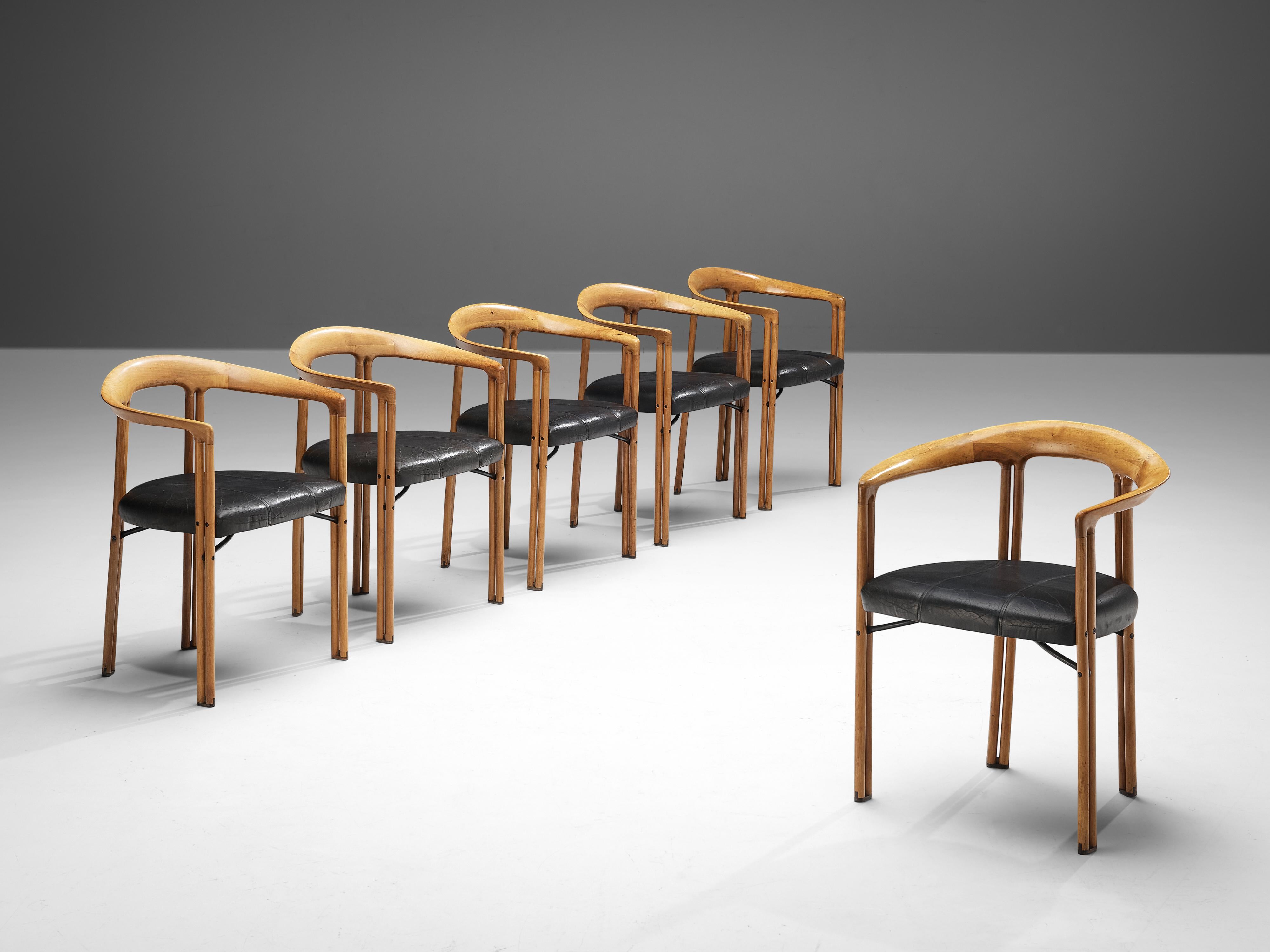 Franco Poli for Bernini, 'Ulna' dining chairs, walnut, leather, Italy, 1986.

7 collection Morentz + 3 additional chairs
