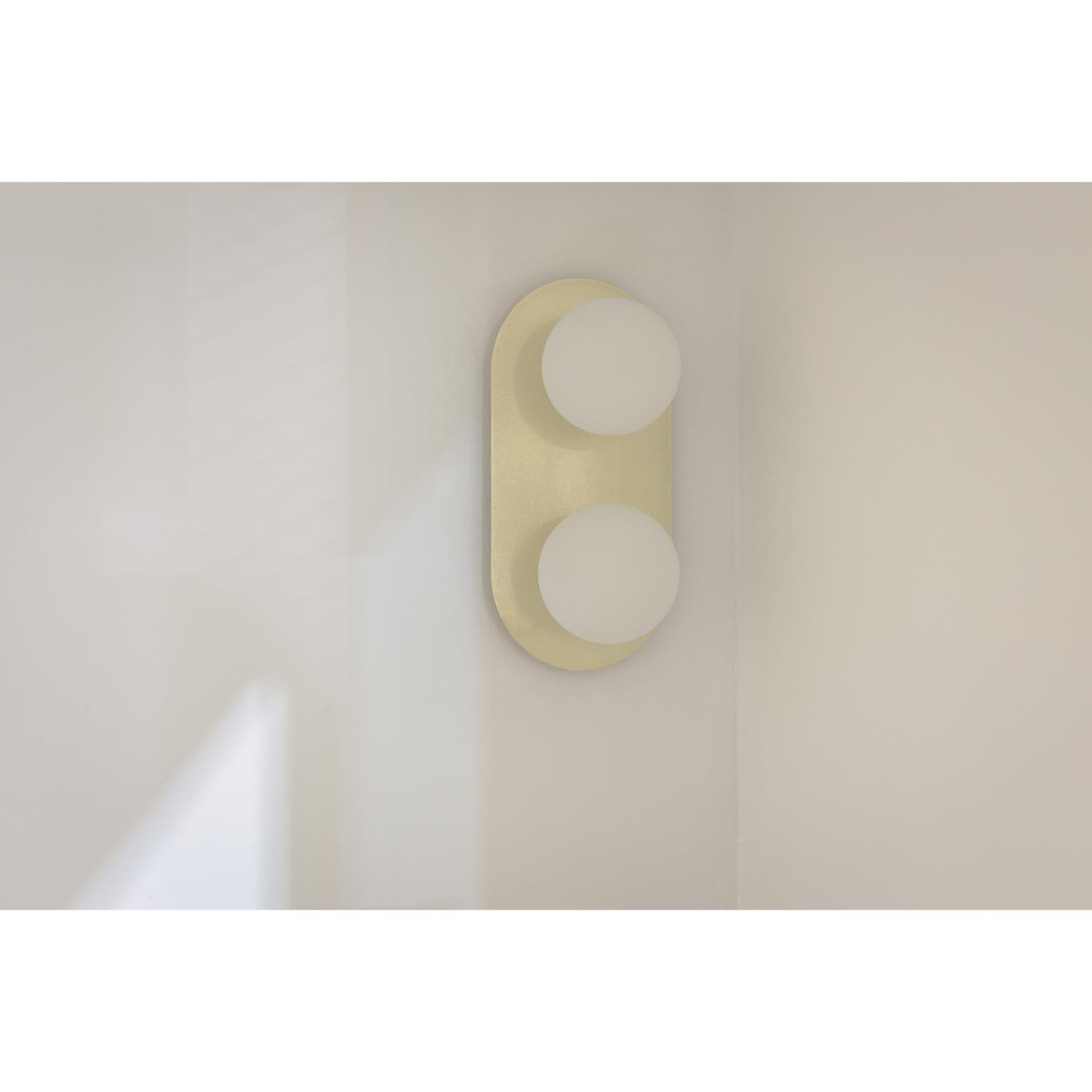 Lita Double Wall Sconce in Brushed Brass with Opaline Glass Spheres by Nuumbra
Dimensions: Ø 30 x H 30 cm. 
Materials: Brushed brass and opaline glass.

Available in brushed or aged brass. Prices may vary. All our lamps can be wired according to