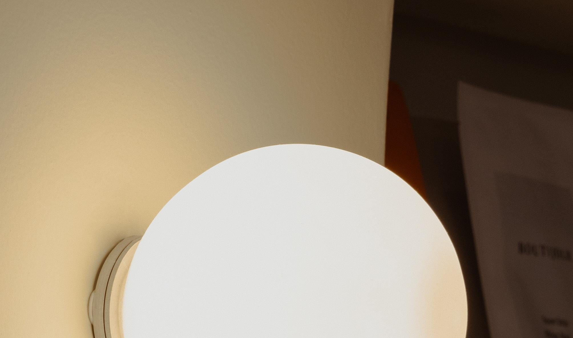 Modern Lita Wall Sconce in Brushed Brass with Opaline Sphere Glass by Nuumbra For Sale