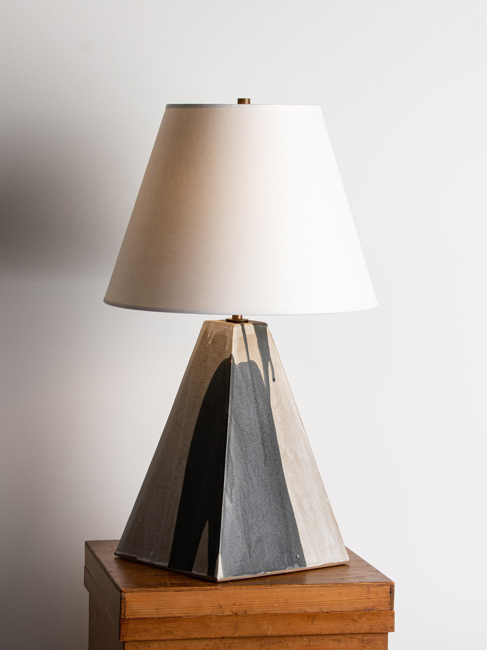 Our stoneware Litchfield Lamp is handcrafted using slab-construction techniques. The lamp’s pattern is created by rolling the surface with textured rolling pins and rods.

FINISH

- Parchment & matte-black poured glaze
- Antique brass fittings
-
