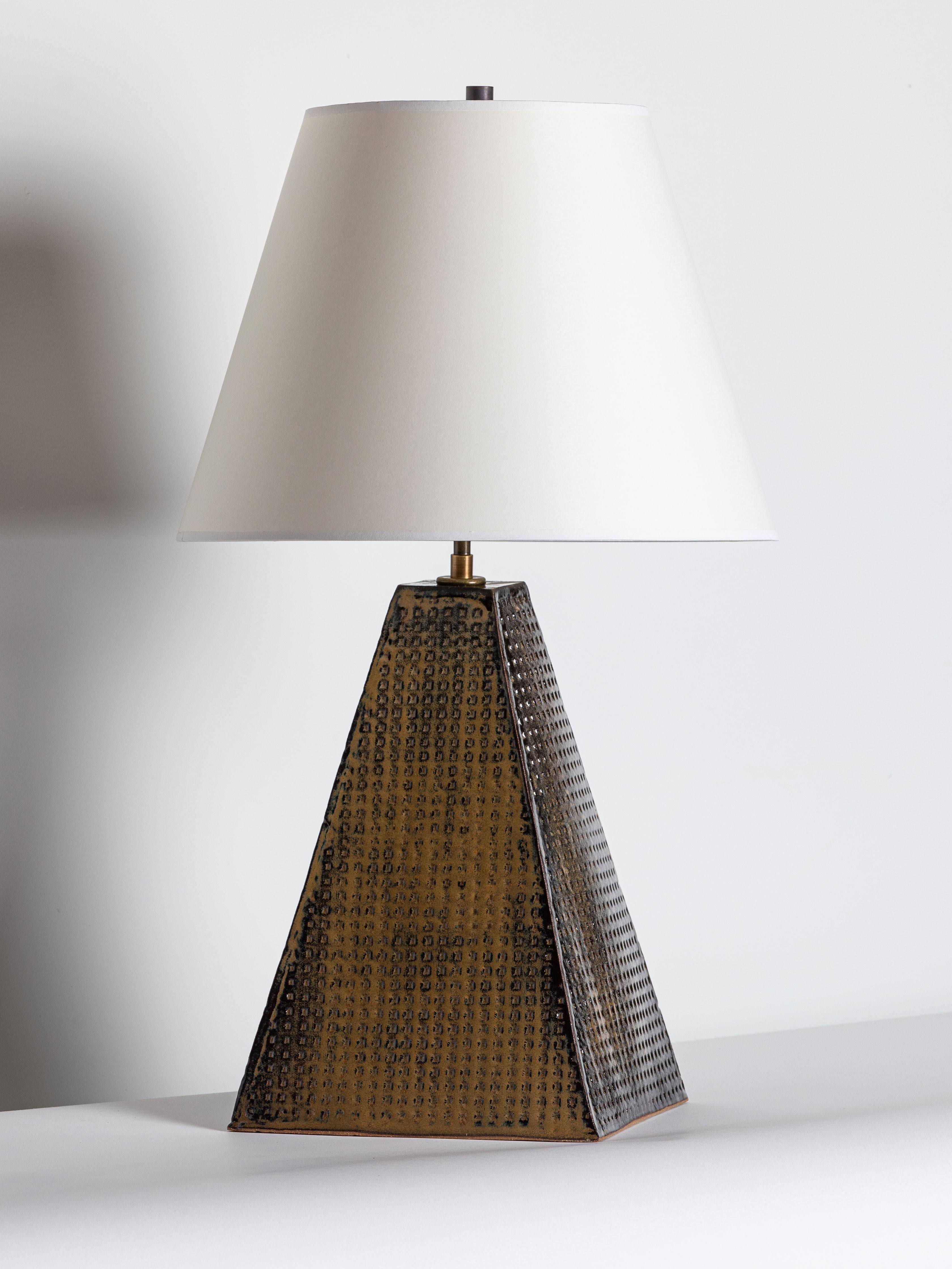 Our stoneware Litchfield Lamp is handcrafted using slab-construction techniques. The lamp’s pattern is created by rolling the surface with textured rolling pins and rods.

Finish

- Poured glaze, pictured in mushroom
- Antique brass fittings
-