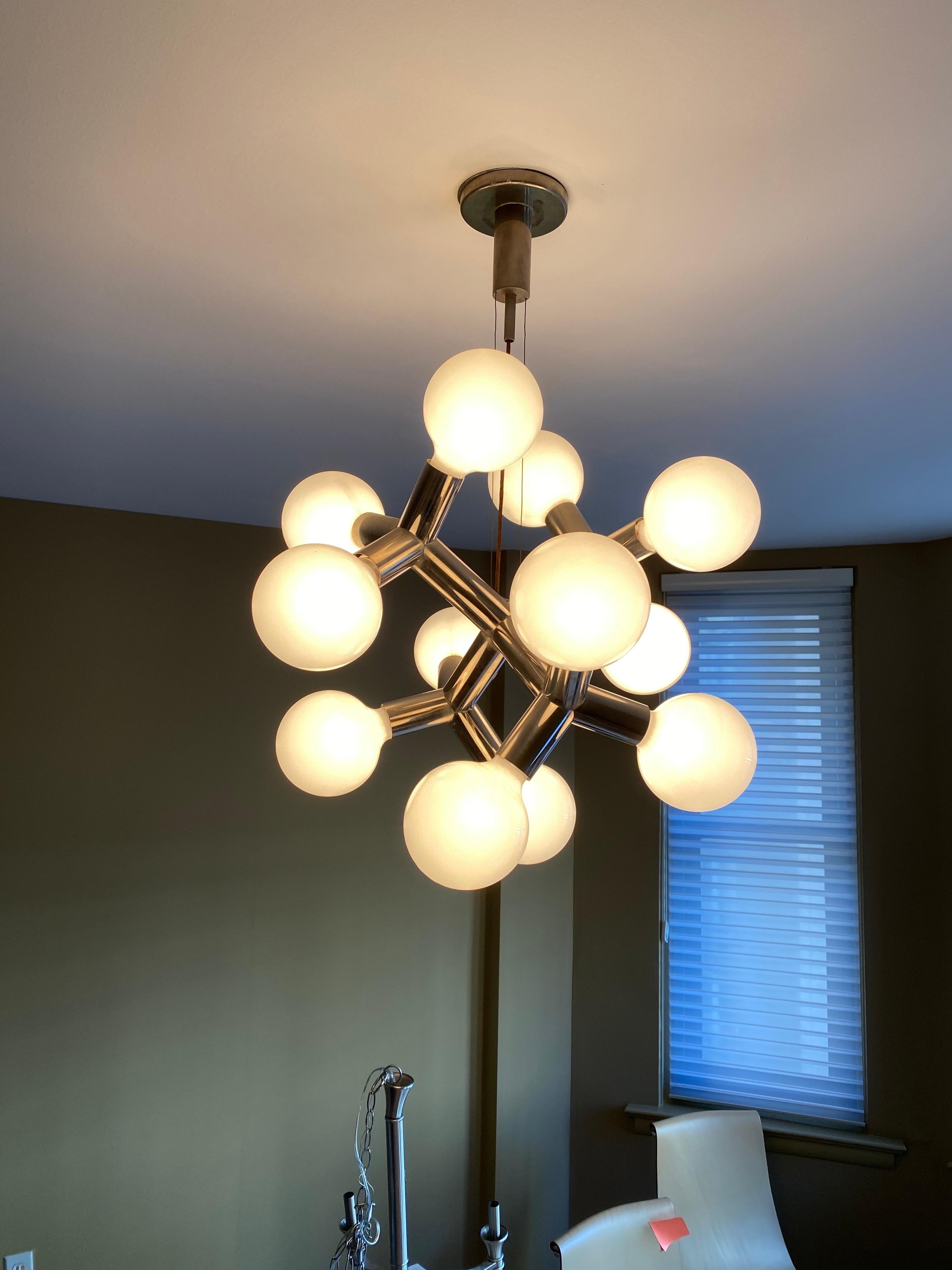 Lite craft hanging atomic chandelier. Great Design and very well made! Somewhat similar to Robert Haussmann Fixtures, but this one is all cast or joined without seams etc. Currently set up to hang down about 30