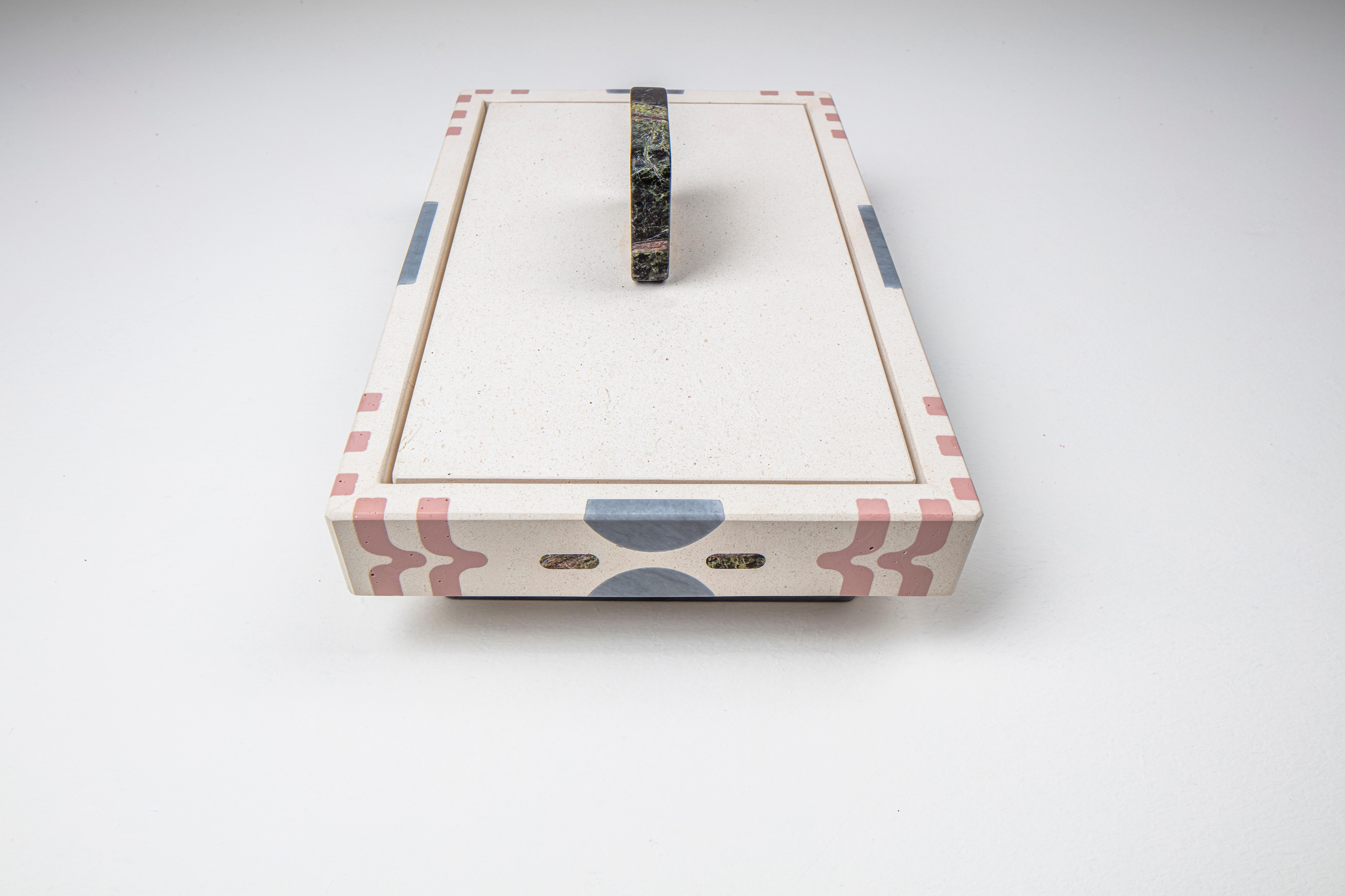 Centrotavola LIMARSI disegnato da Elena Salmistraro
Dimensioni: 40x26xh16cm
Materiali: marmo e pietre naturali 
Bianco Fenice, Bardiglio Imperiale, Rosalia, Greene & Greene, Pietra Pece.
