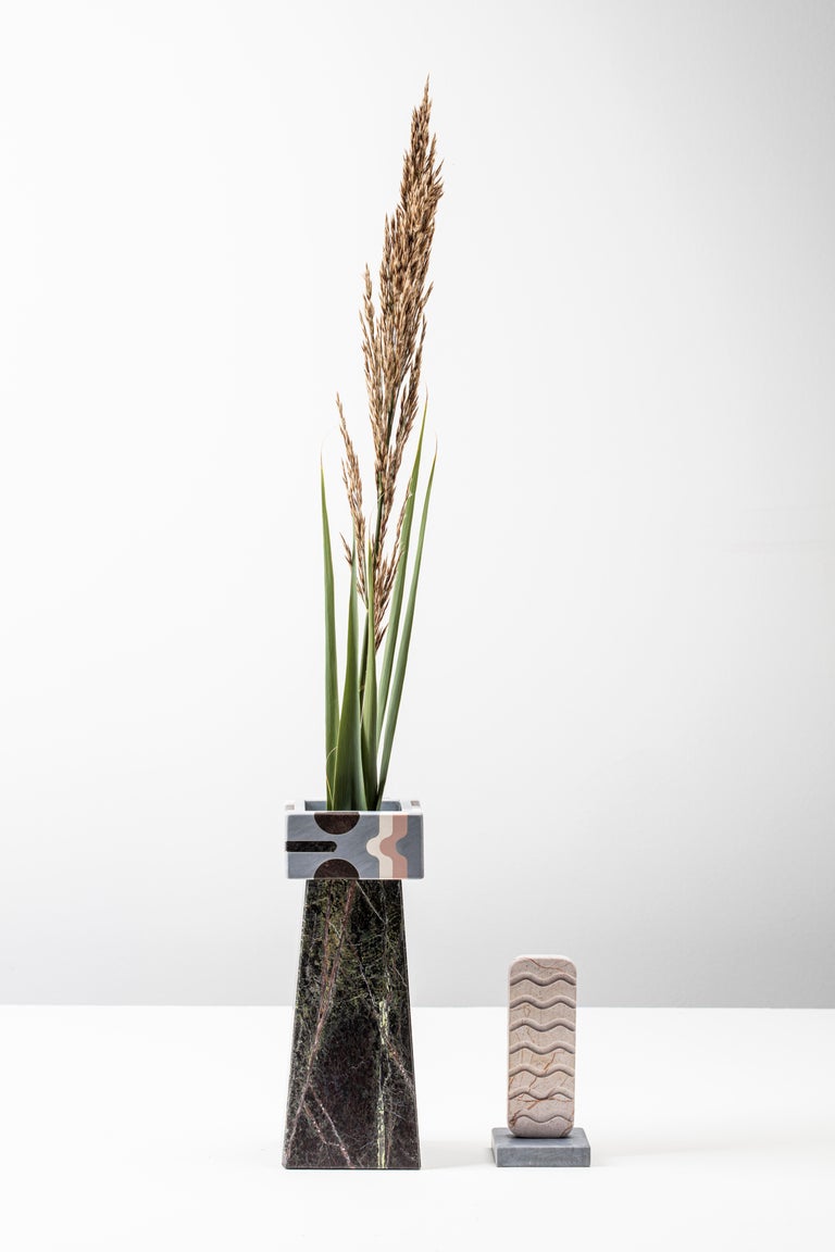 Tracino vase designed by Elena Salmistraro
Dimension: 12 x 12 x H 46cm
Materials: natural marble and stones 
Bianco Fenice, Bardiglio Imperiale, Rosalia, Green Forrest., Pietra Pece.